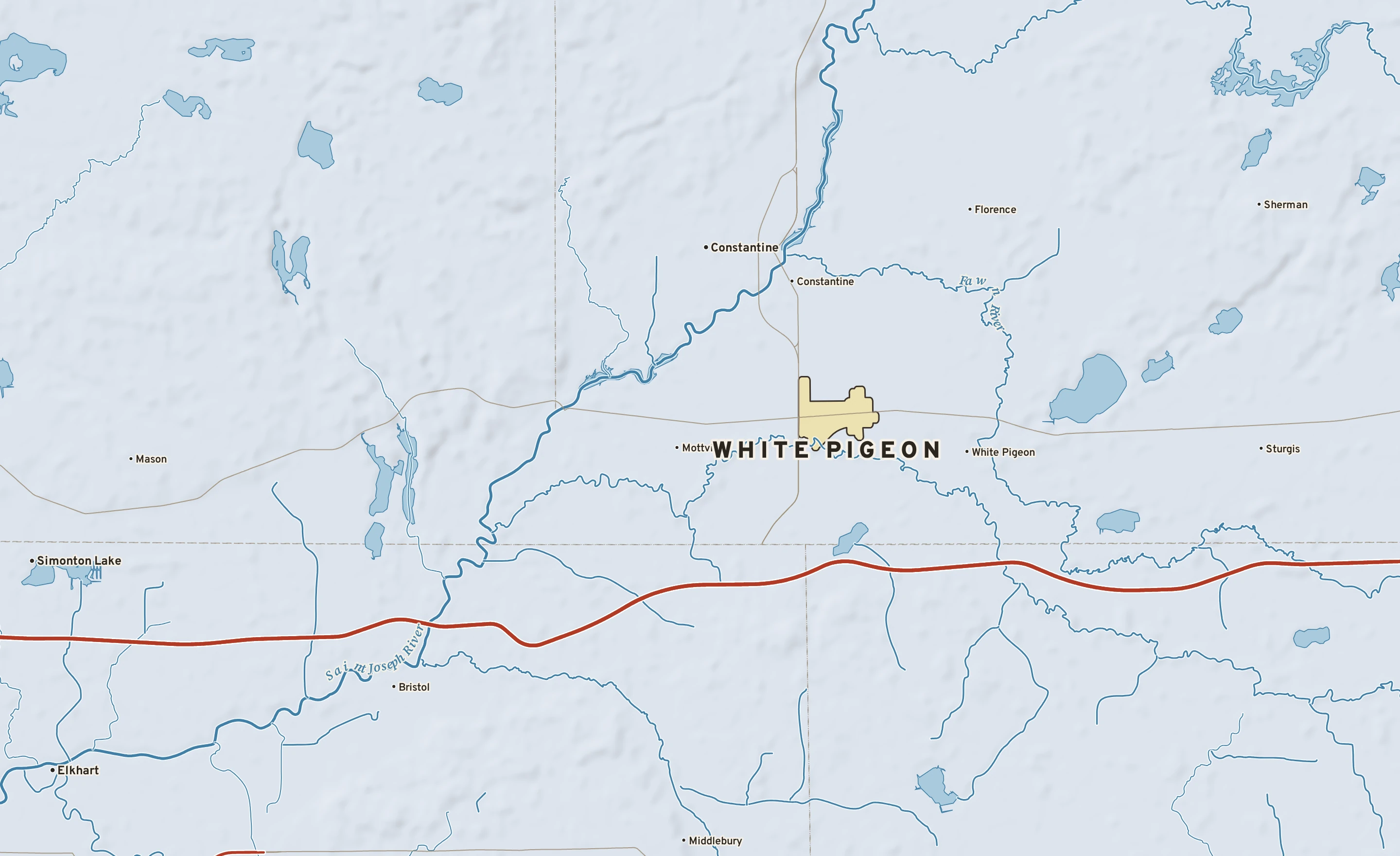 Shaded-relief atlas plate of White Pigeon, Michigan: rivers, roads, the city limits and where the water drains.