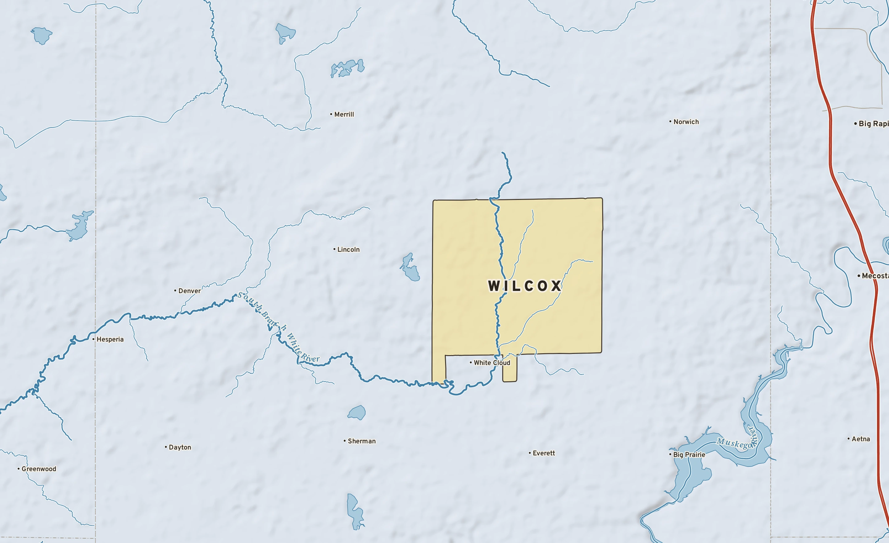 Shaded-relief atlas plate of Wilcox, Michigan: rivers, roads, the city limits and where the water drains.