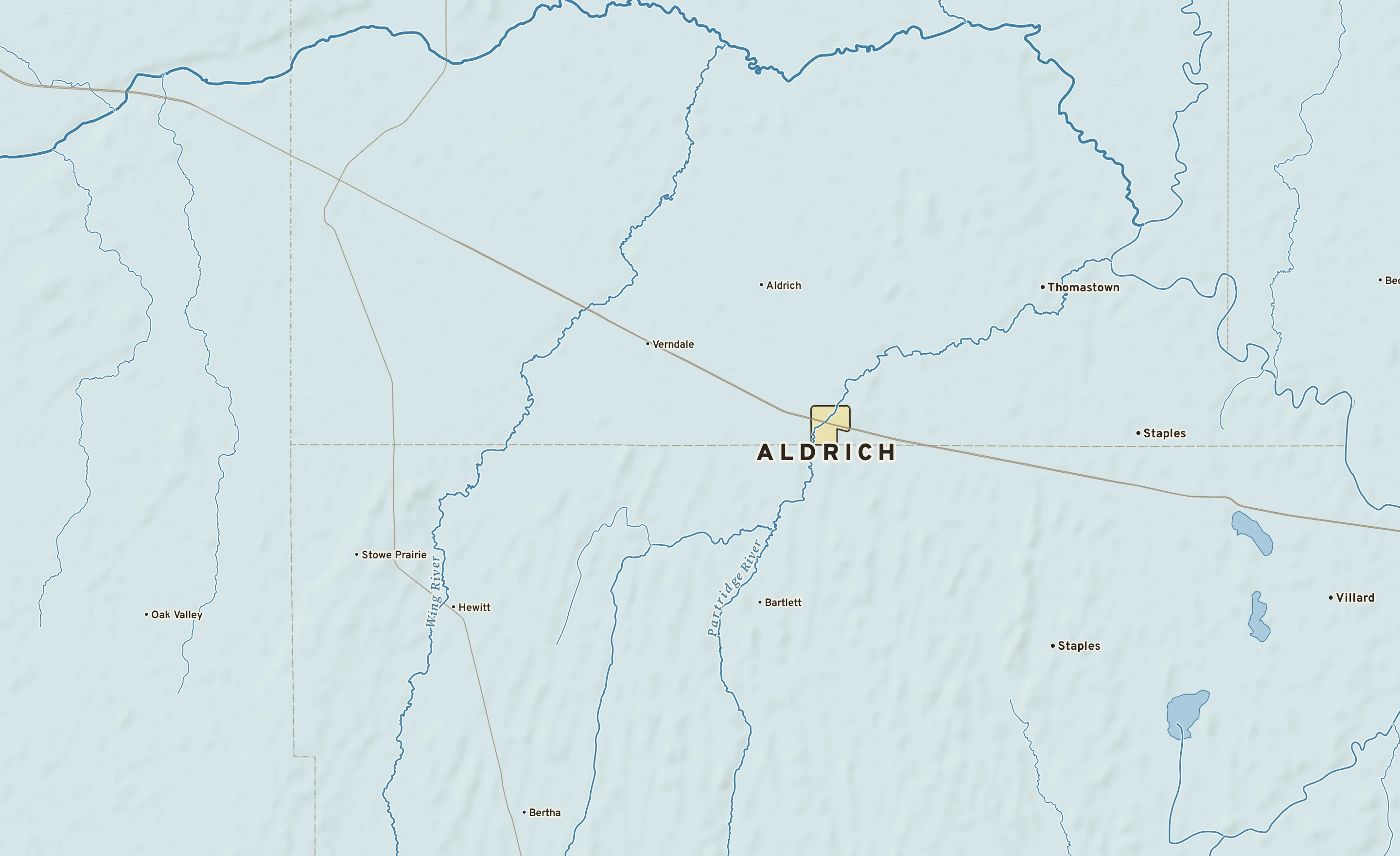 Shaded-relief atlas plate of Aldrich, Minnesota: rivers, roads, the city limits and where the water drains.