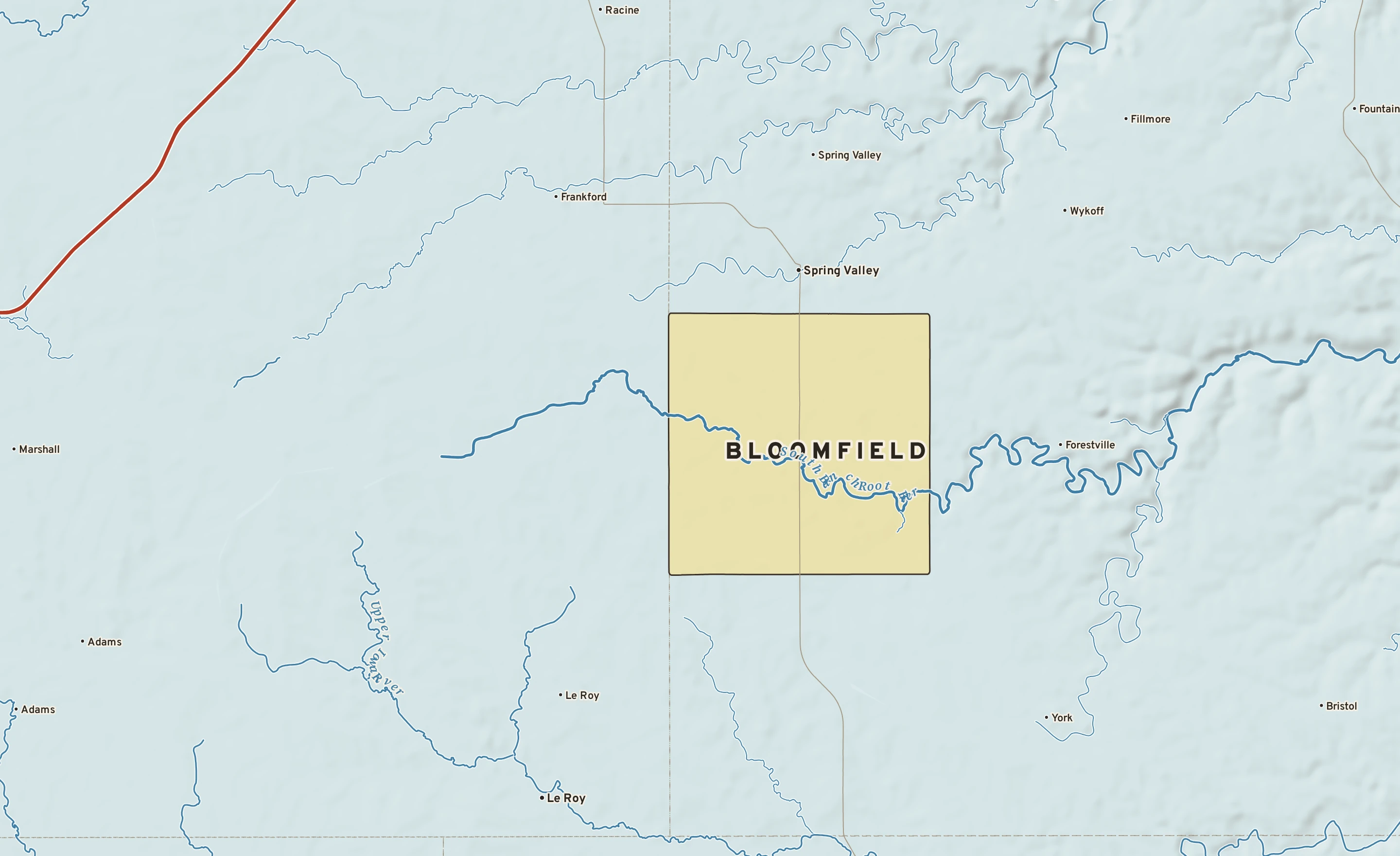 Shaded-relief atlas plate of Bloomfield, Minnesota: rivers, roads, the city limits and where the water drains.