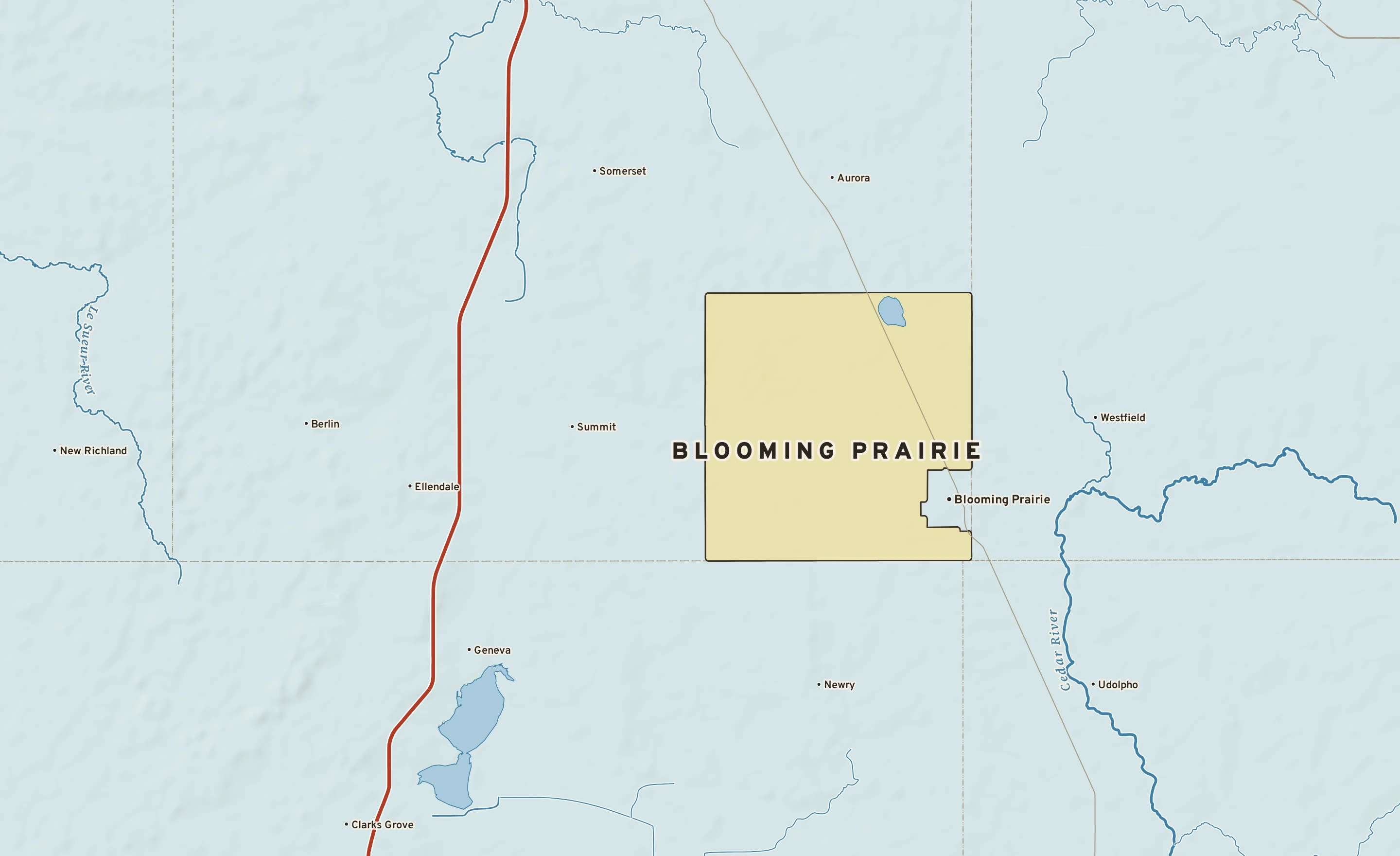 Shaded-relief atlas plate of Blooming Prairie, Minnesota: rivers, roads, the city limits and where the water drains.