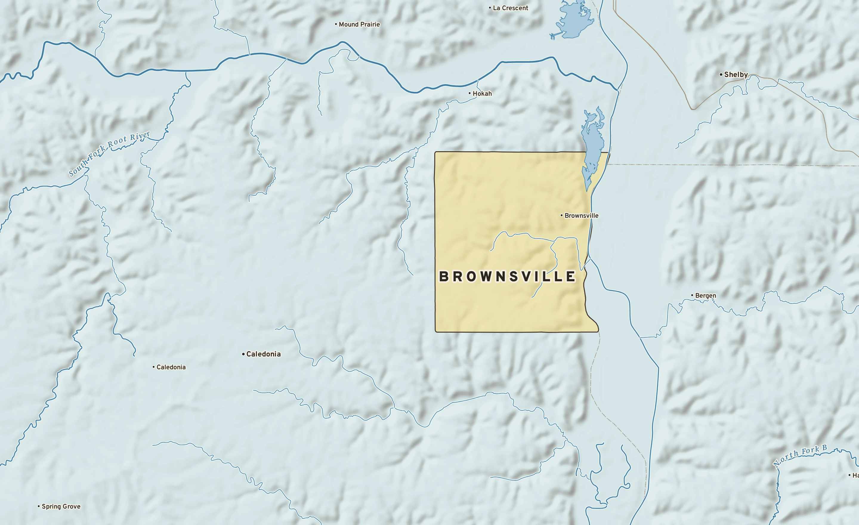 Shaded-relief atlas plate of Brownsville, Minnesota: rivers, roads, the city limits and where the water drains.