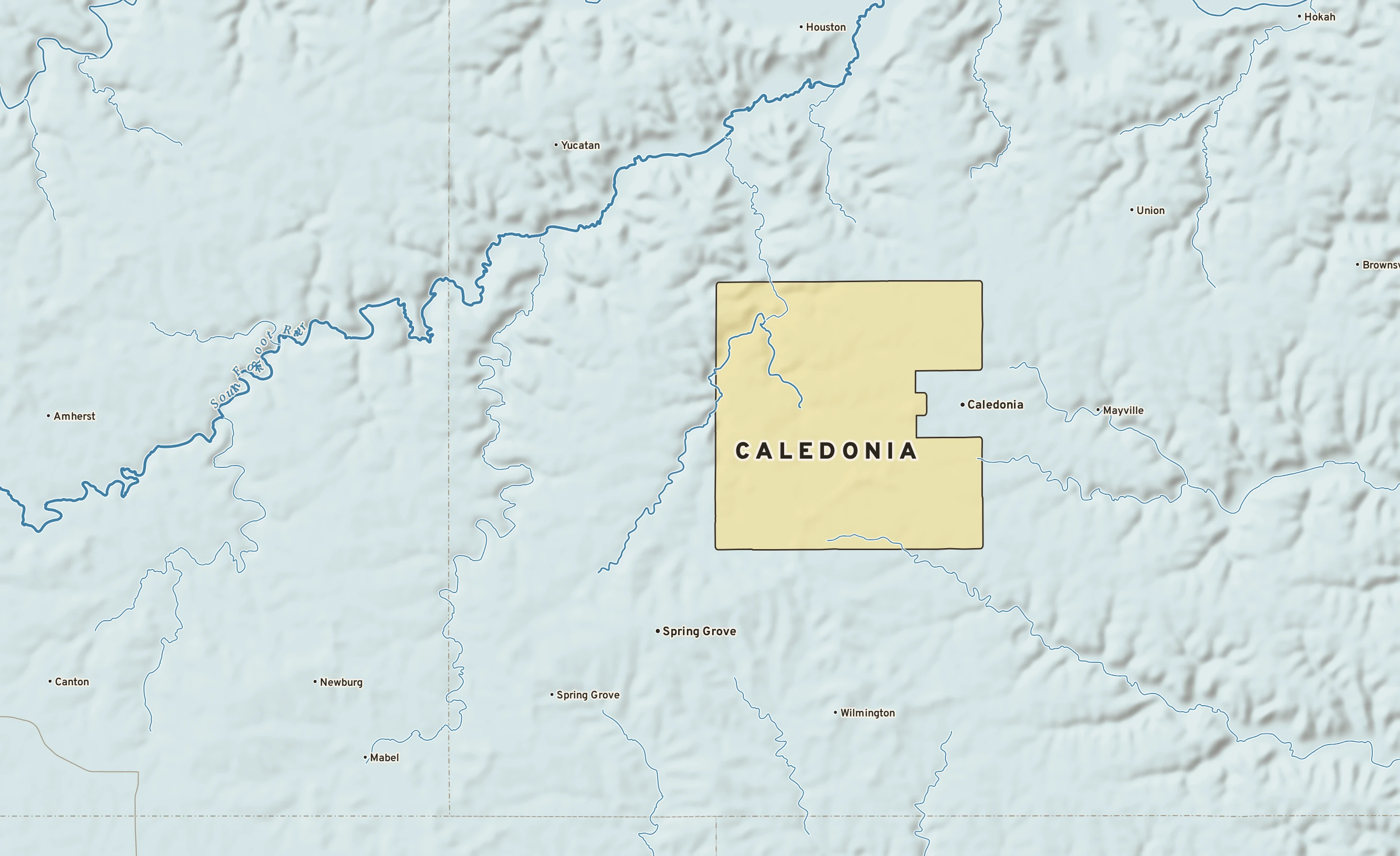 Shaded-relief atlas plate of Caledonia, Minnesota: rivers, roads, the city limits and where the water drains.