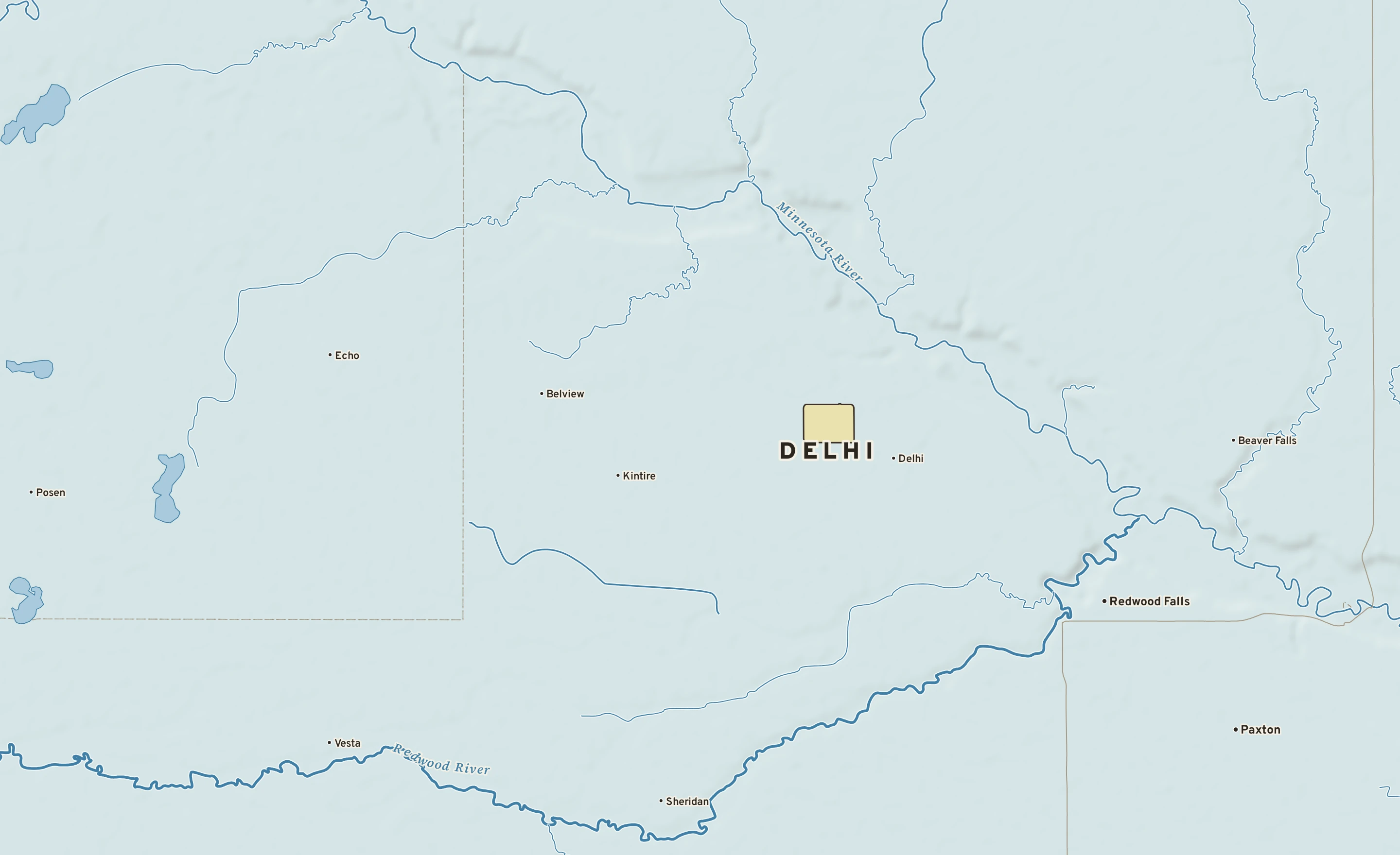 Shaded-relief atlas plate of Delhi, Minnesota: rivers, roads, the city limits and where the water drains.