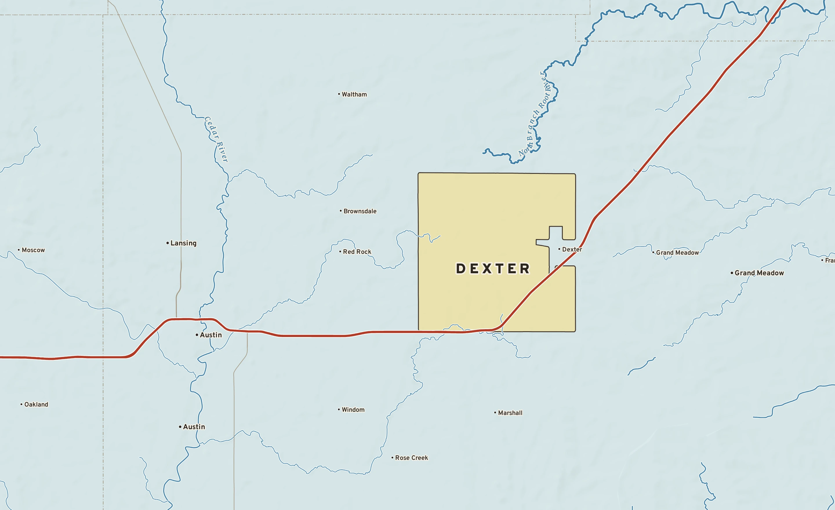Shaded-relief atlas plate of Dexter, Minnesota: rivers, roads, the city limits and where the water drains.