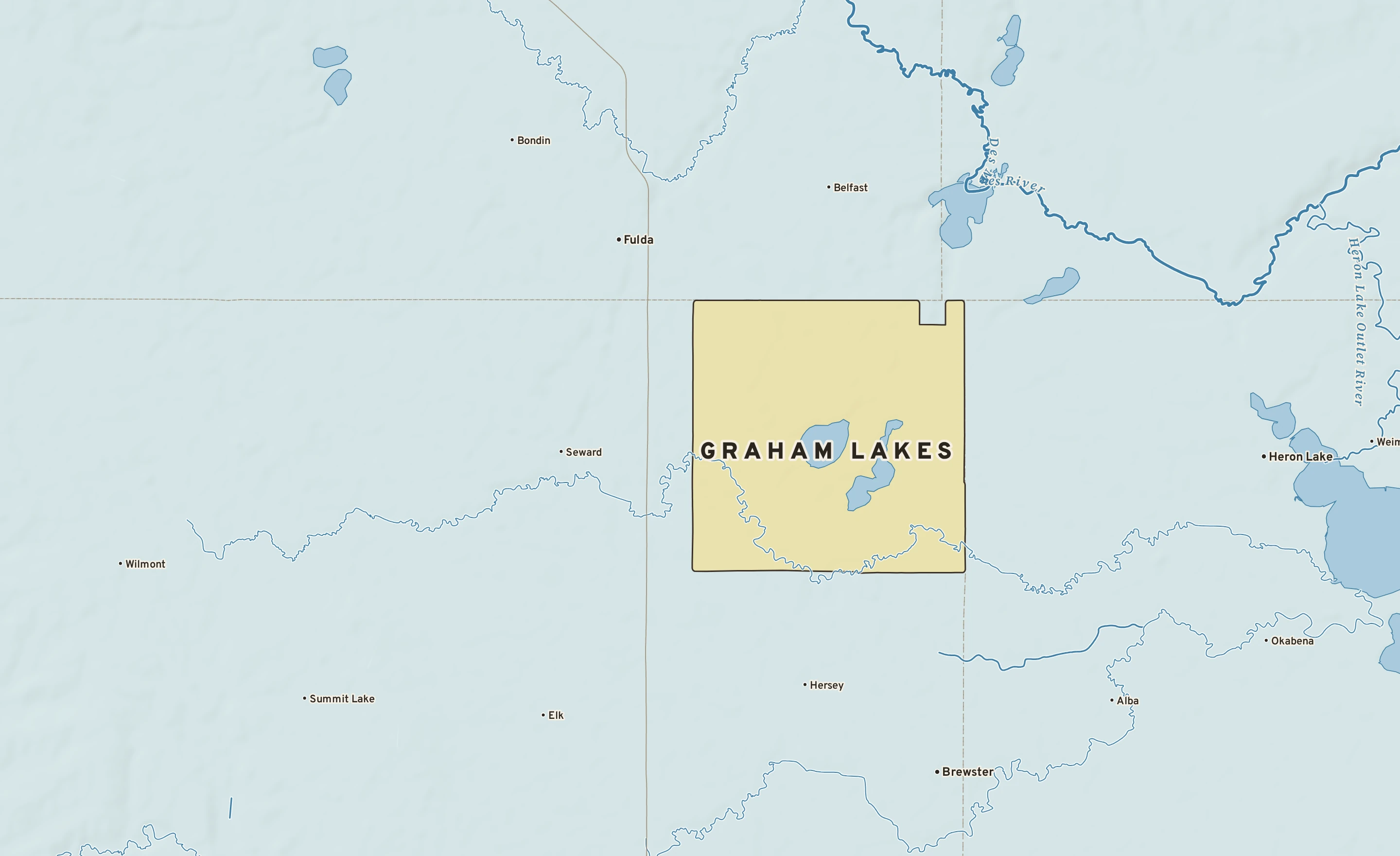 Shaded-relief atlas plate of Graham Lakes, Minnesota: rivers, roads, the city limits and where the water drains.