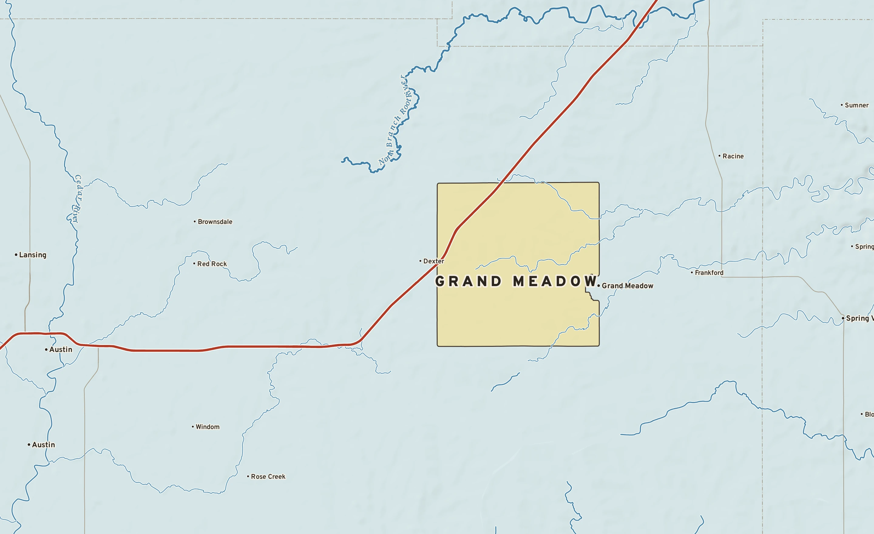 Shaded-relief atlas plate of Grand Meadow, Minnesota: rivers, roads, the city limits and where the water drains.