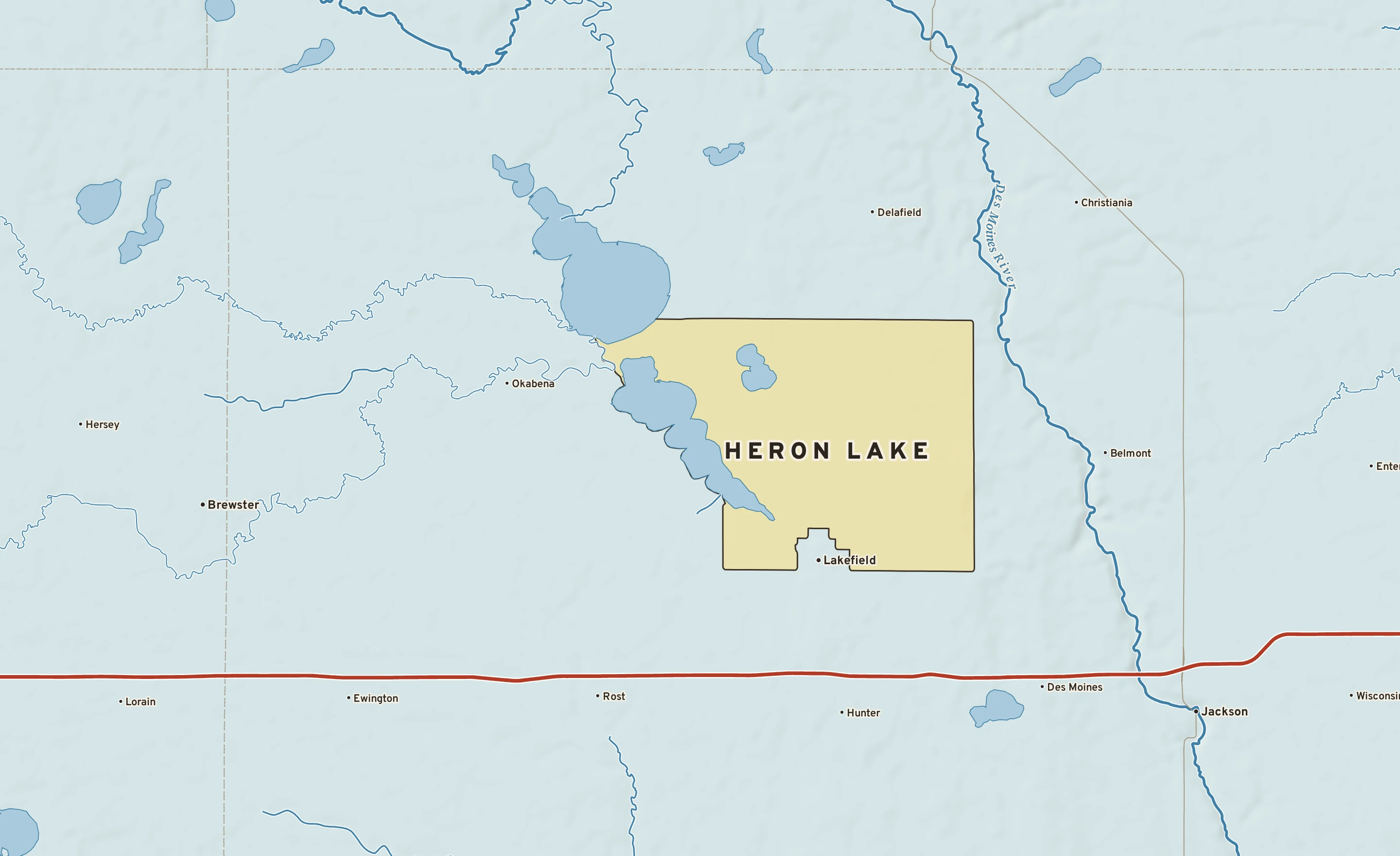 Shaded-relief atlas plate of Heron Lake, Minnesota: rivers, roads, the city limits and where the water drains.