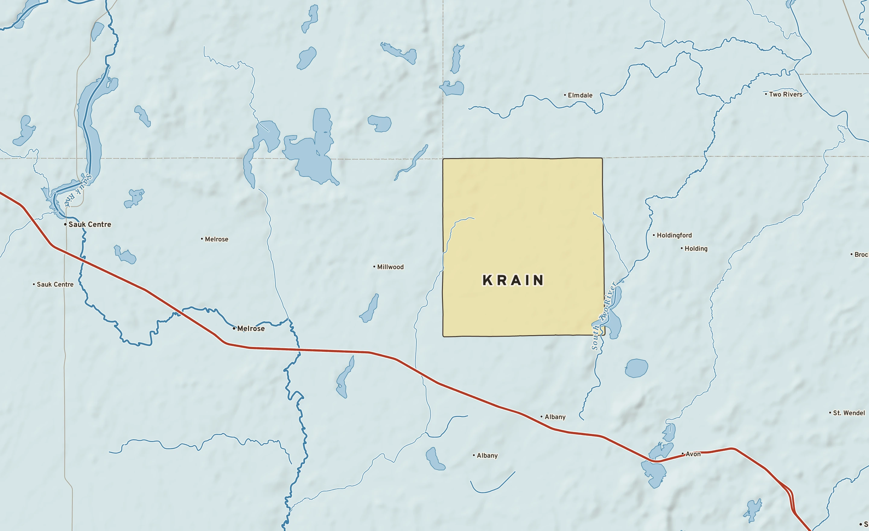Shaded-relief atlas plate of Krain, Minnesota: rivers, roads, the city limits and where the water drains.