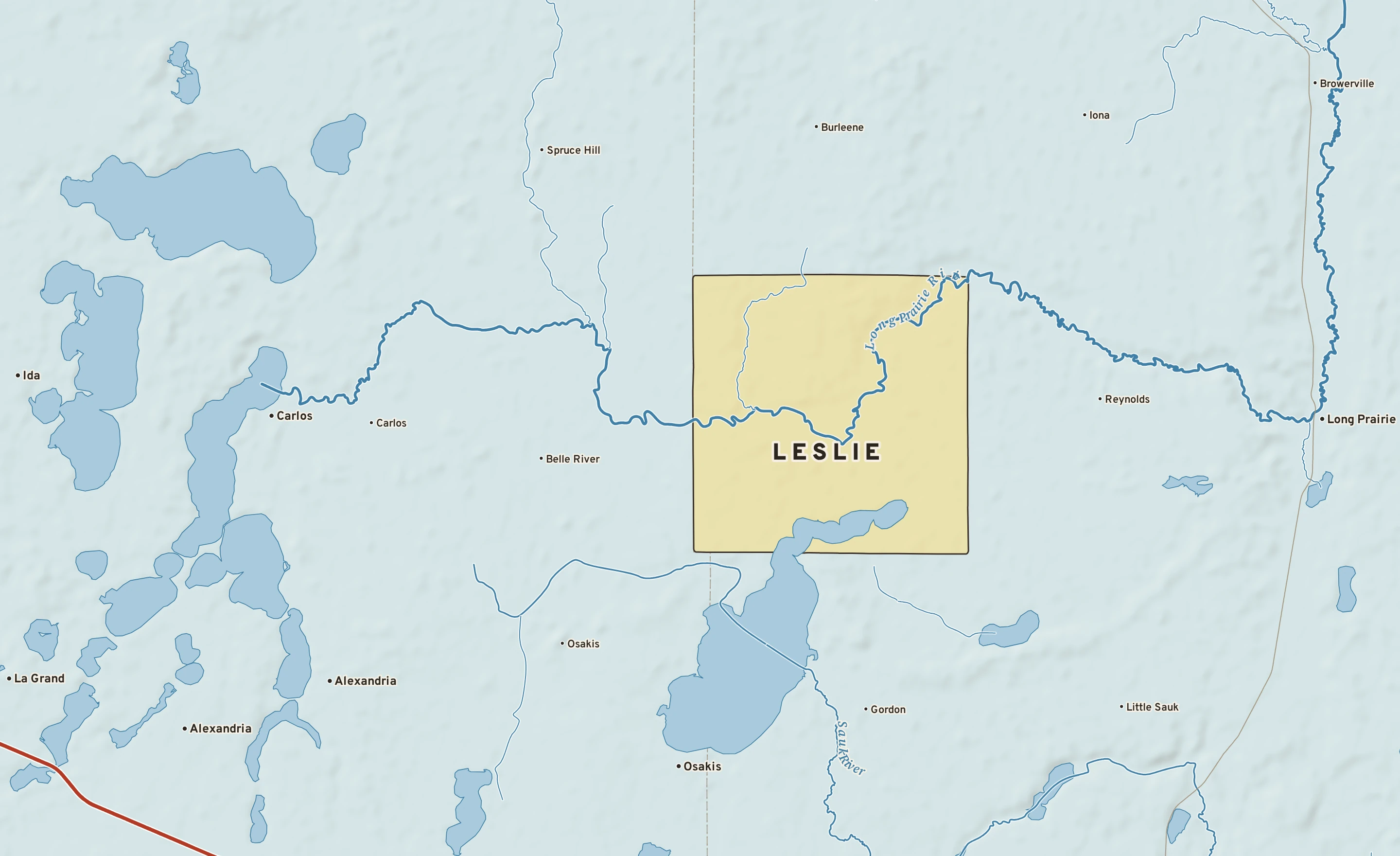 Shaded-relief atlas plate of Leslie, Minnesota: rivers, roads, the city limits and where the water drains.