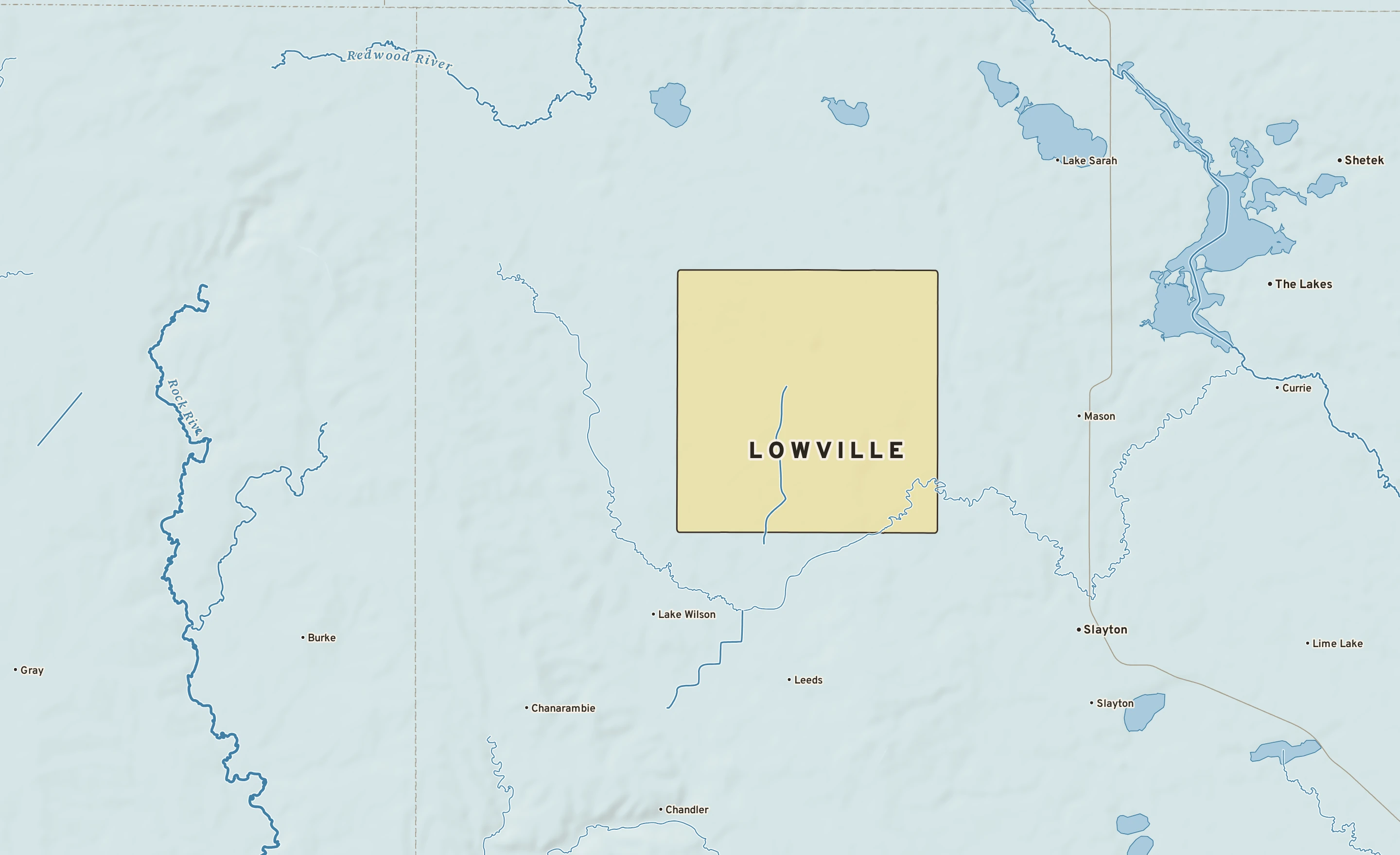 Shaded-relief atlas plate of Lowville, Minnesota: rivers, roads, the city limits and where the water drains.