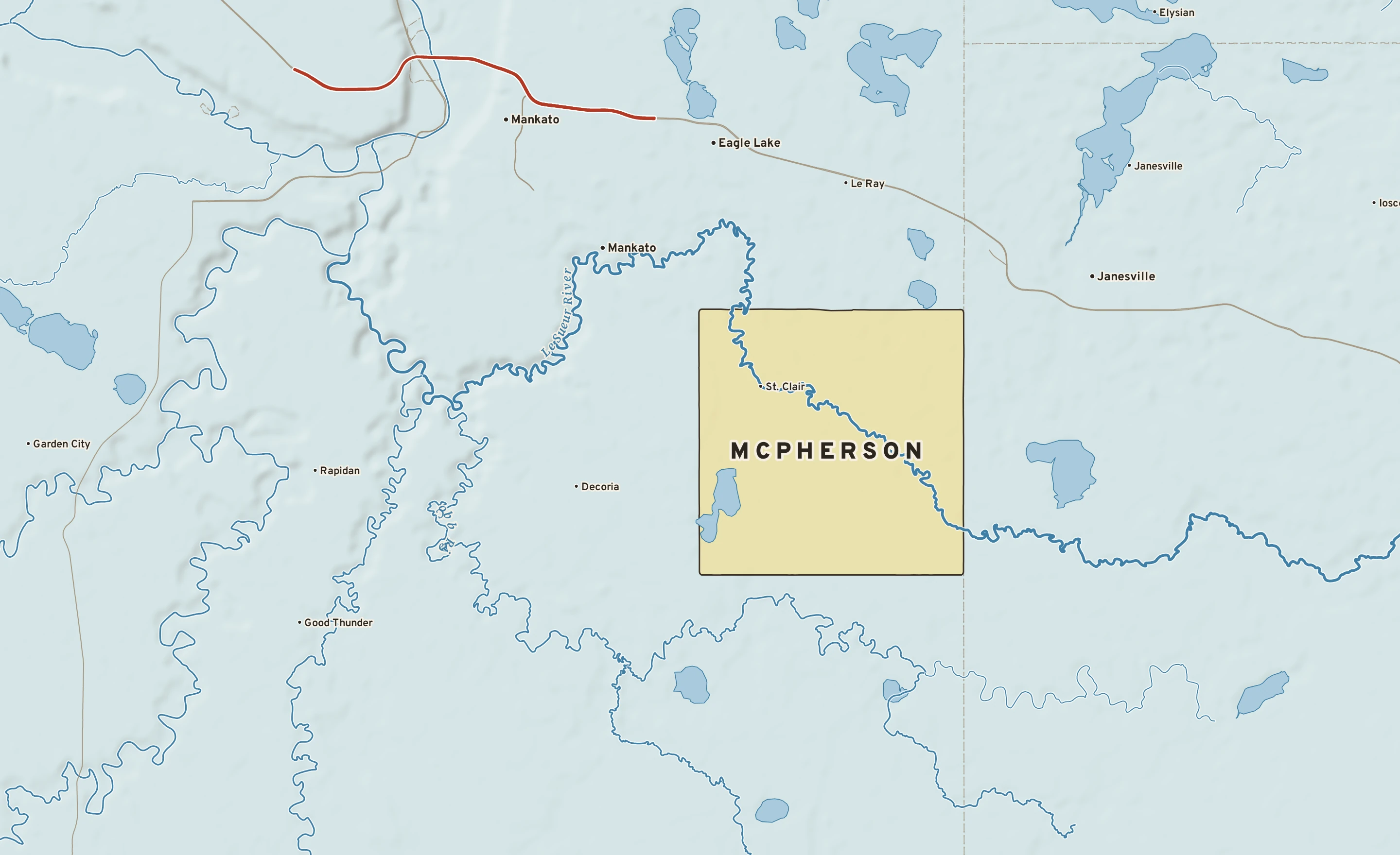 Shaded-relief atlas plate of McPherson, Minnesota: rivers, roads, the city limits and where the water drains.