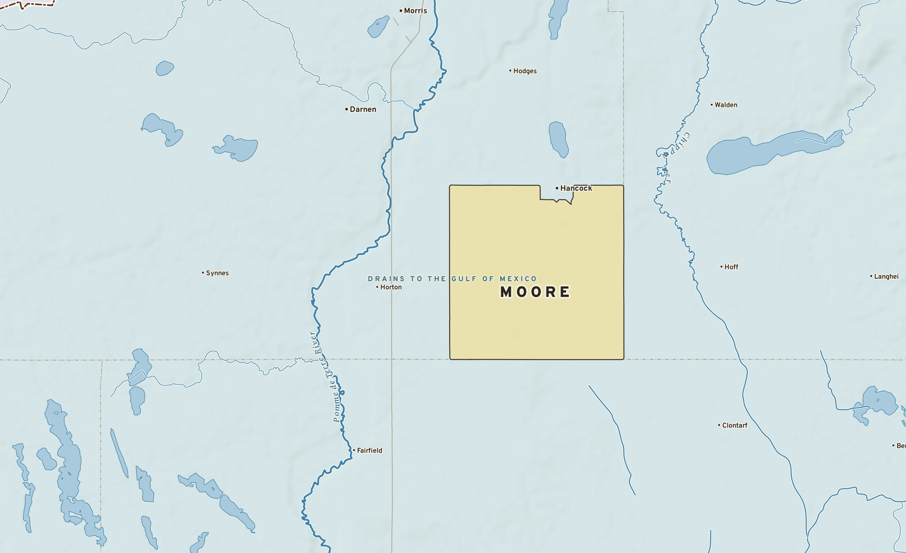 Shaded-relief atlas plate of Moore, Minnesota: rivers, roads, the city limits and where the water drains.