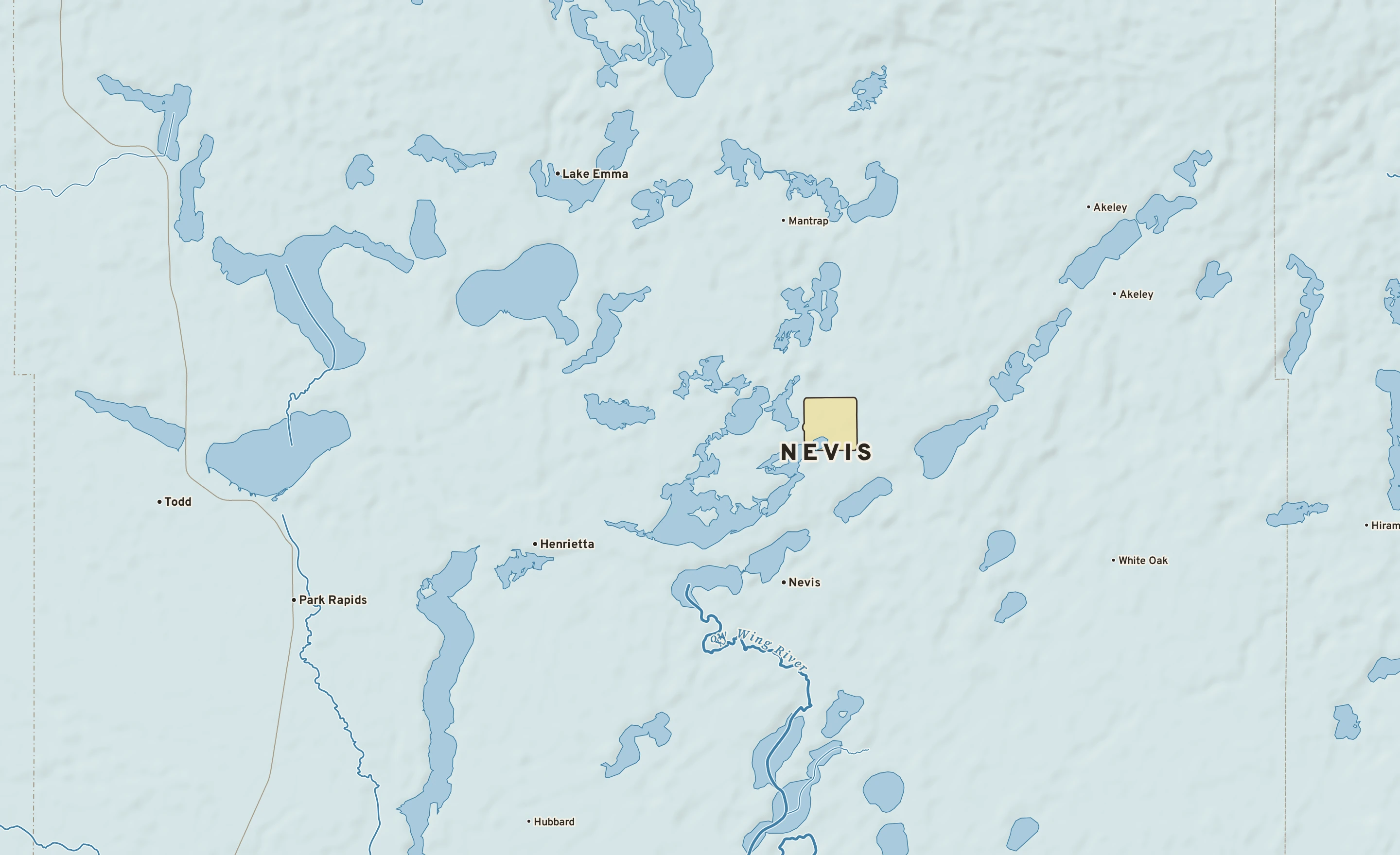 Shaded-relief atlas plate of Nevis, Minnesota: rivers, roads, the city limits and where the water drains.