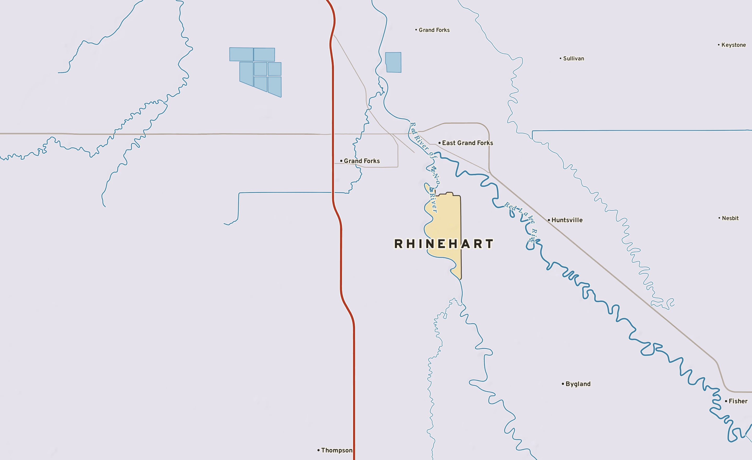 Shaded-relief atlas plate of Rhinehart, Minnesota: rivers, roads, the city limits and where the water drains.
