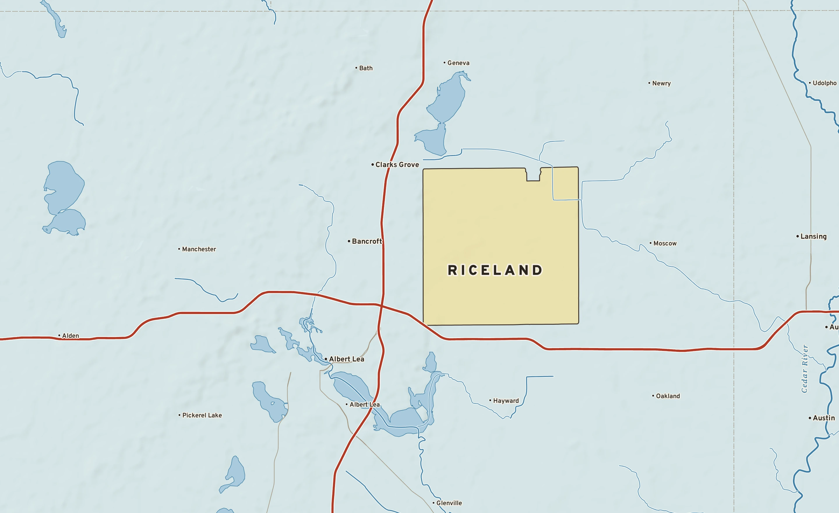 Shaded-relief atlas plate of Riceland, Minnesota: rivers, roads, the city limits and where the water drains.