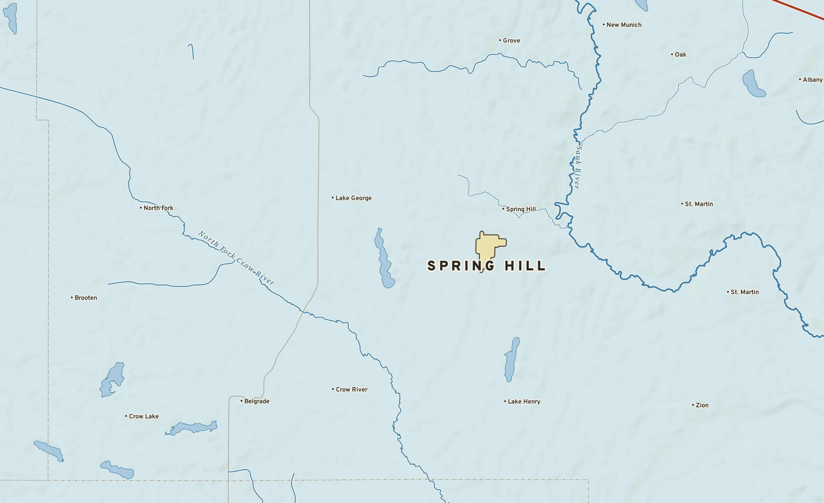 Shaded-relief atlas plate of Spring Hill, Minnesota: rivers, roads, the city limits and where the water drains.