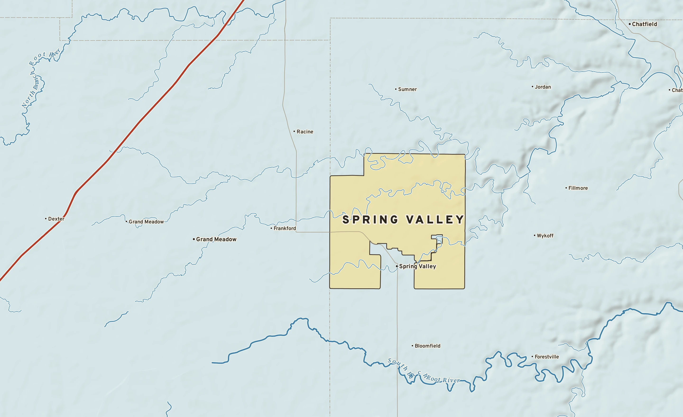Shaded-relief atlas plate of Spring Valley, Minnesota: rivers, roads, the city limits and where the water drains.
