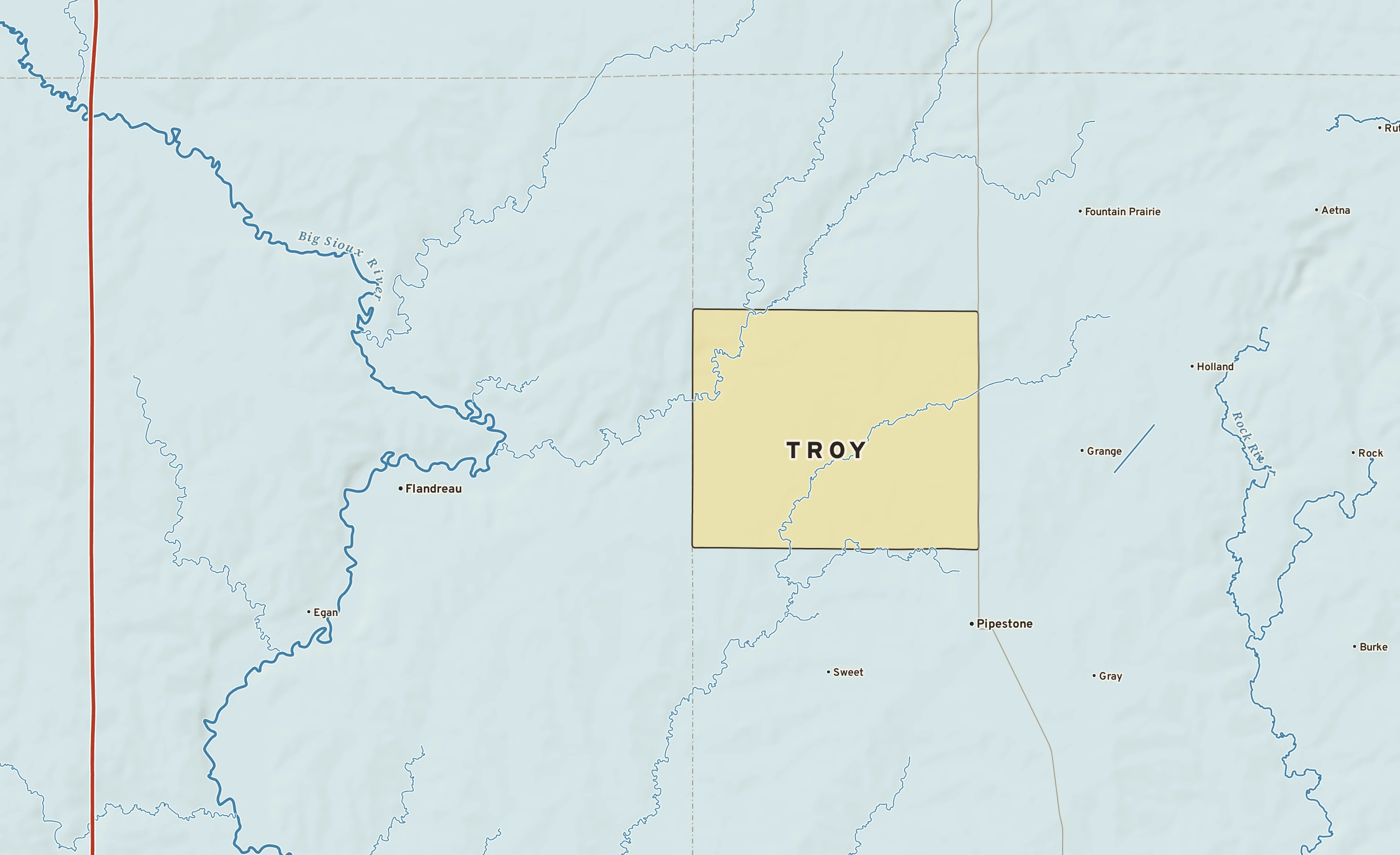 Shaded-relief atlas plate of Troy, Minnesota: rivers, roads, the city limits and where the water drains.