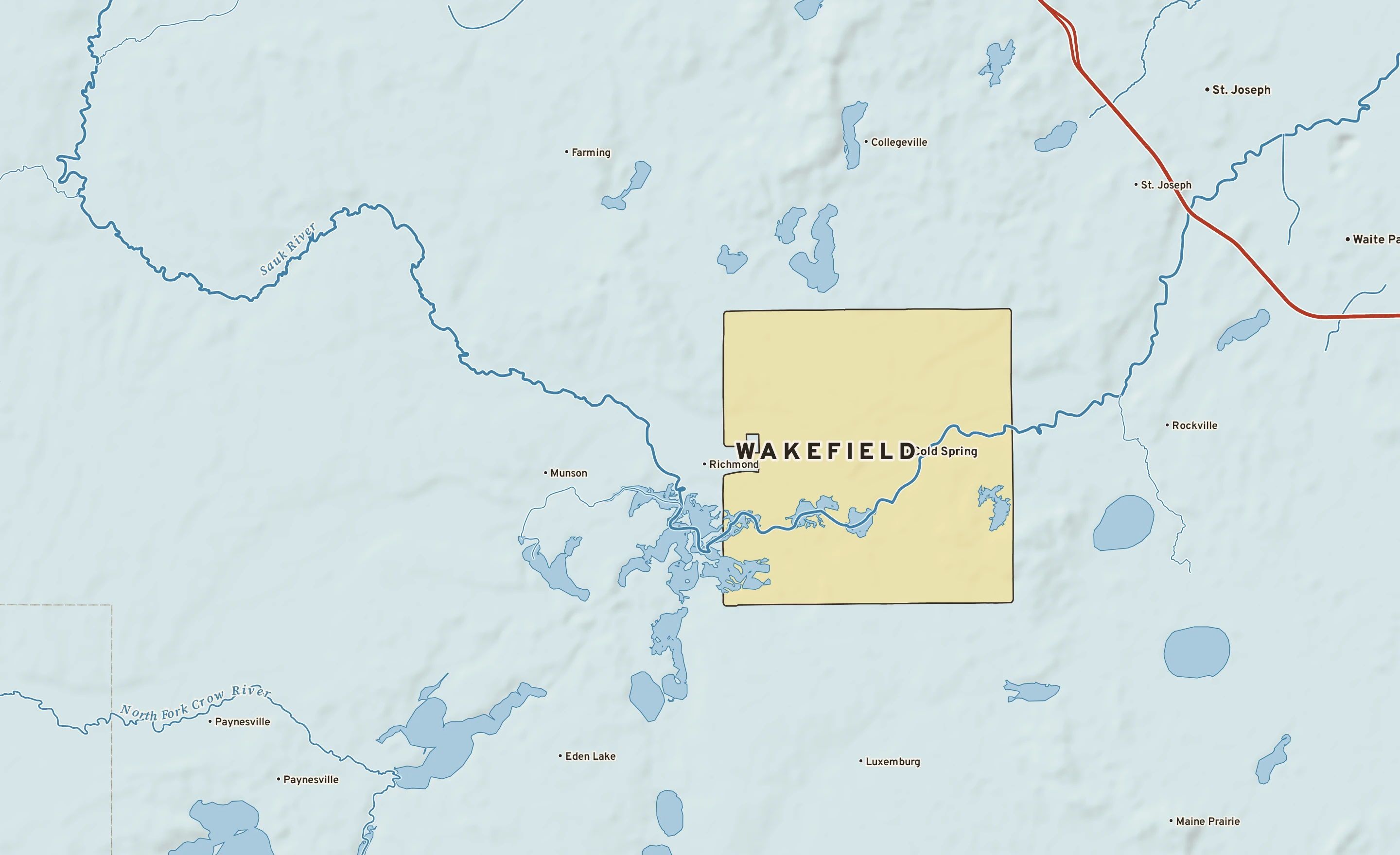 Shaded-relief atlas plate of Wakefield, Minnesota: rivers, roads, the city limits and where the water drains.