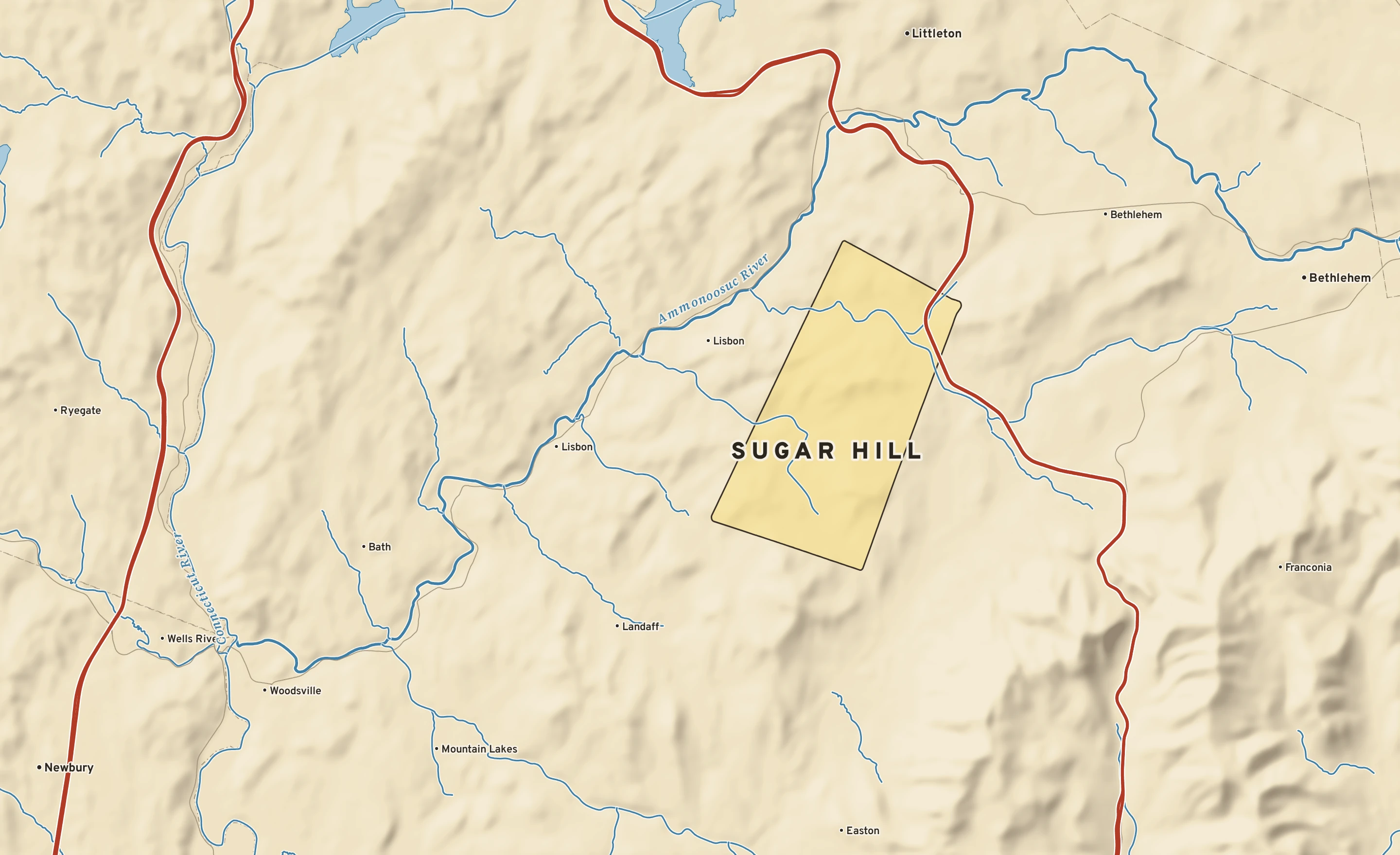 Shaded-relief atlas plate of Sugar Hill, New Hampshire: rivers, roads, the city limits and where the water drains.