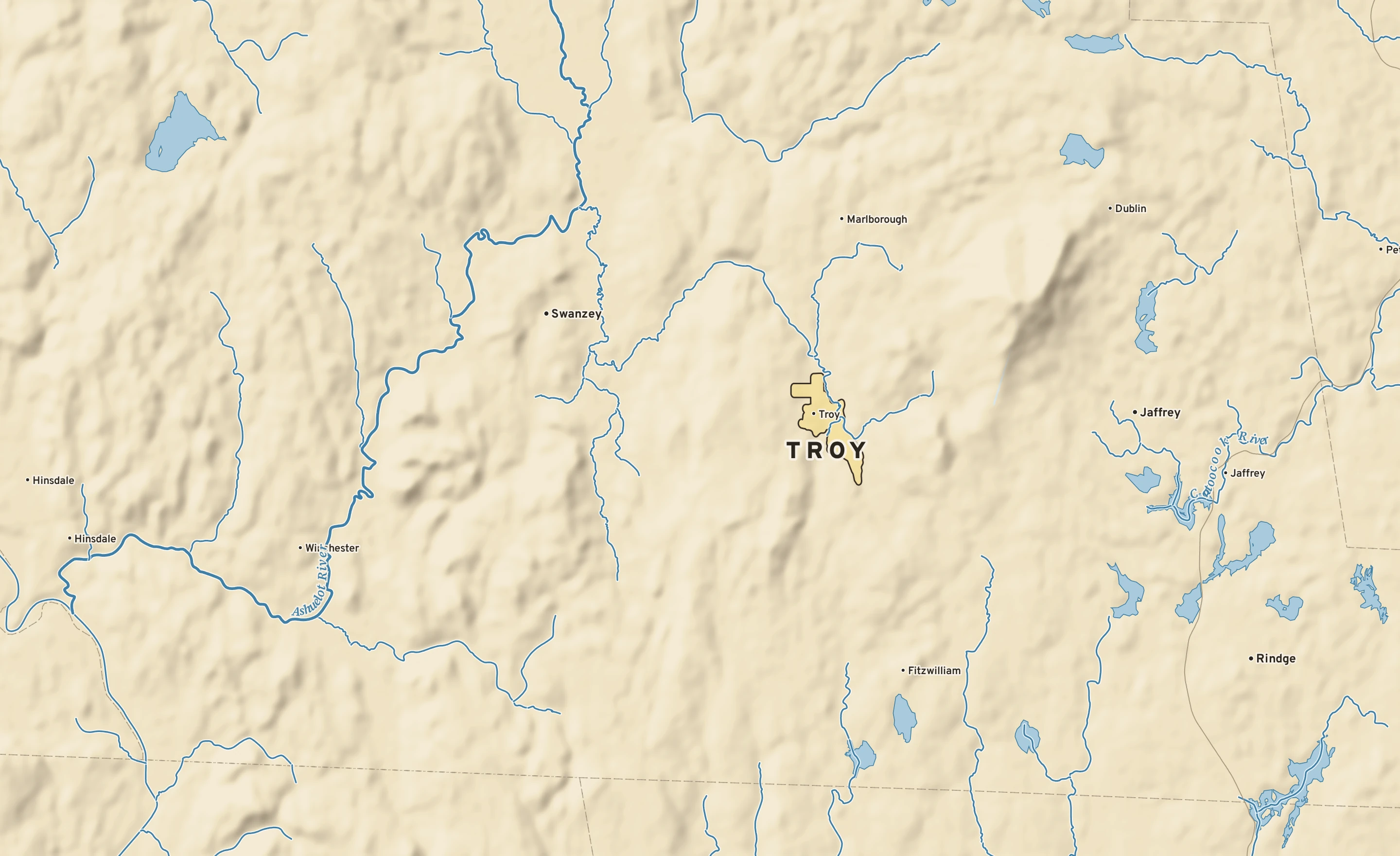 Shaded-relief atlas plate of Troy, New Hampshire: rivers, roads, the city limits and where the water drains.
