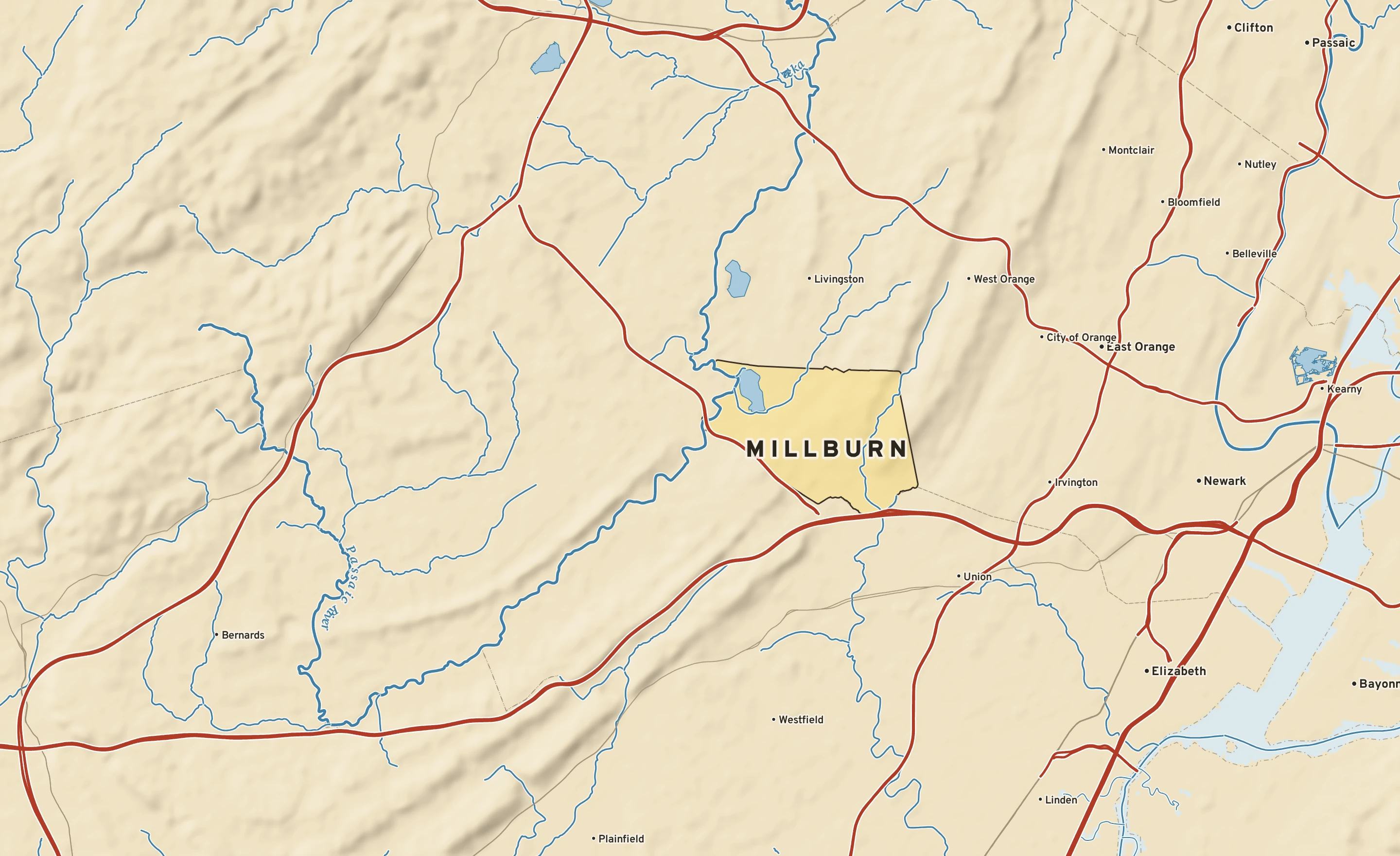 Shaded-relief atlas plate of Millburn, New Jersey: rivers, roads, the city limits and where the water drains.