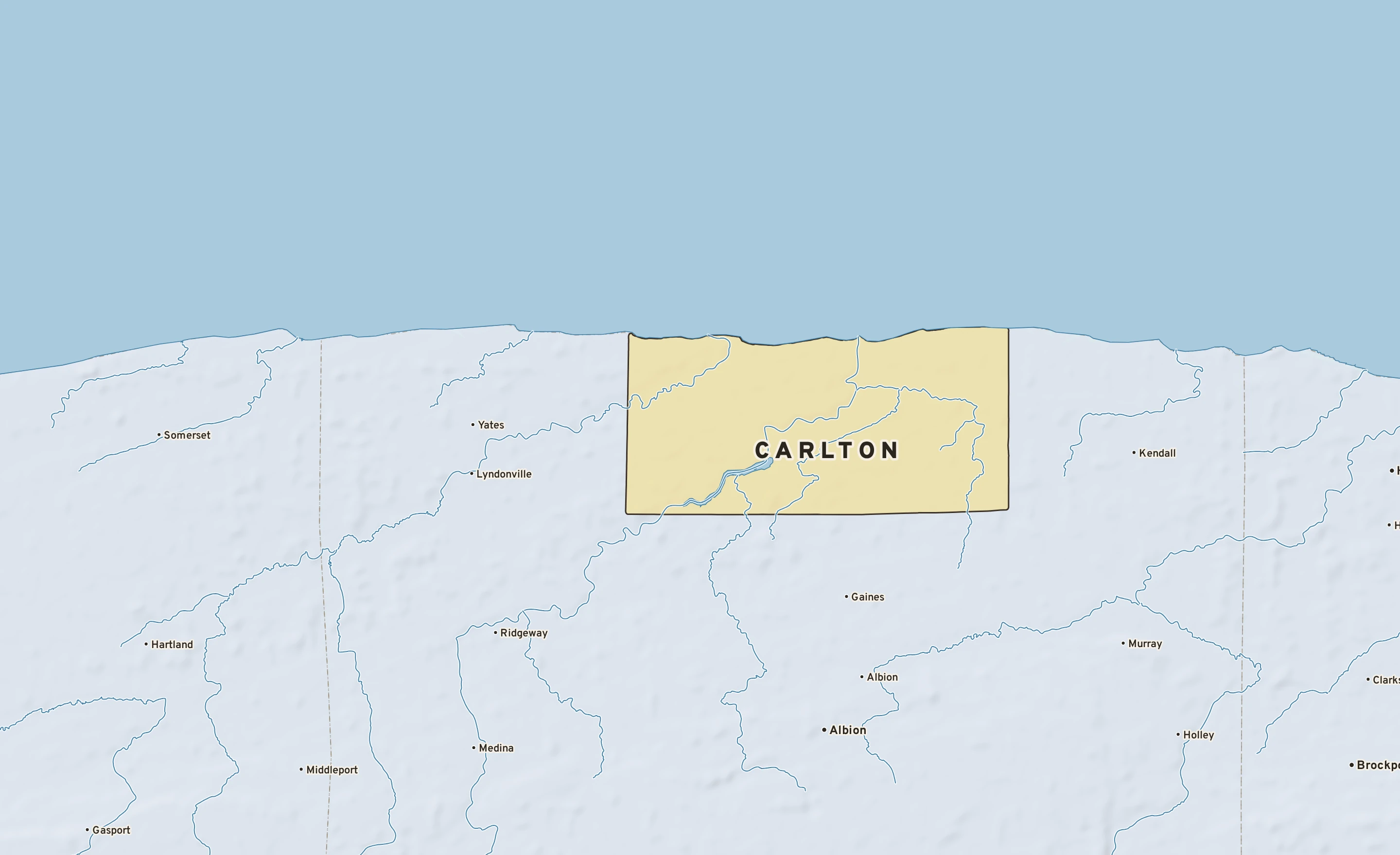 Shaded-relief atlas plate of Carlton, New York: rivers, roads, the city limits and where the water drains.