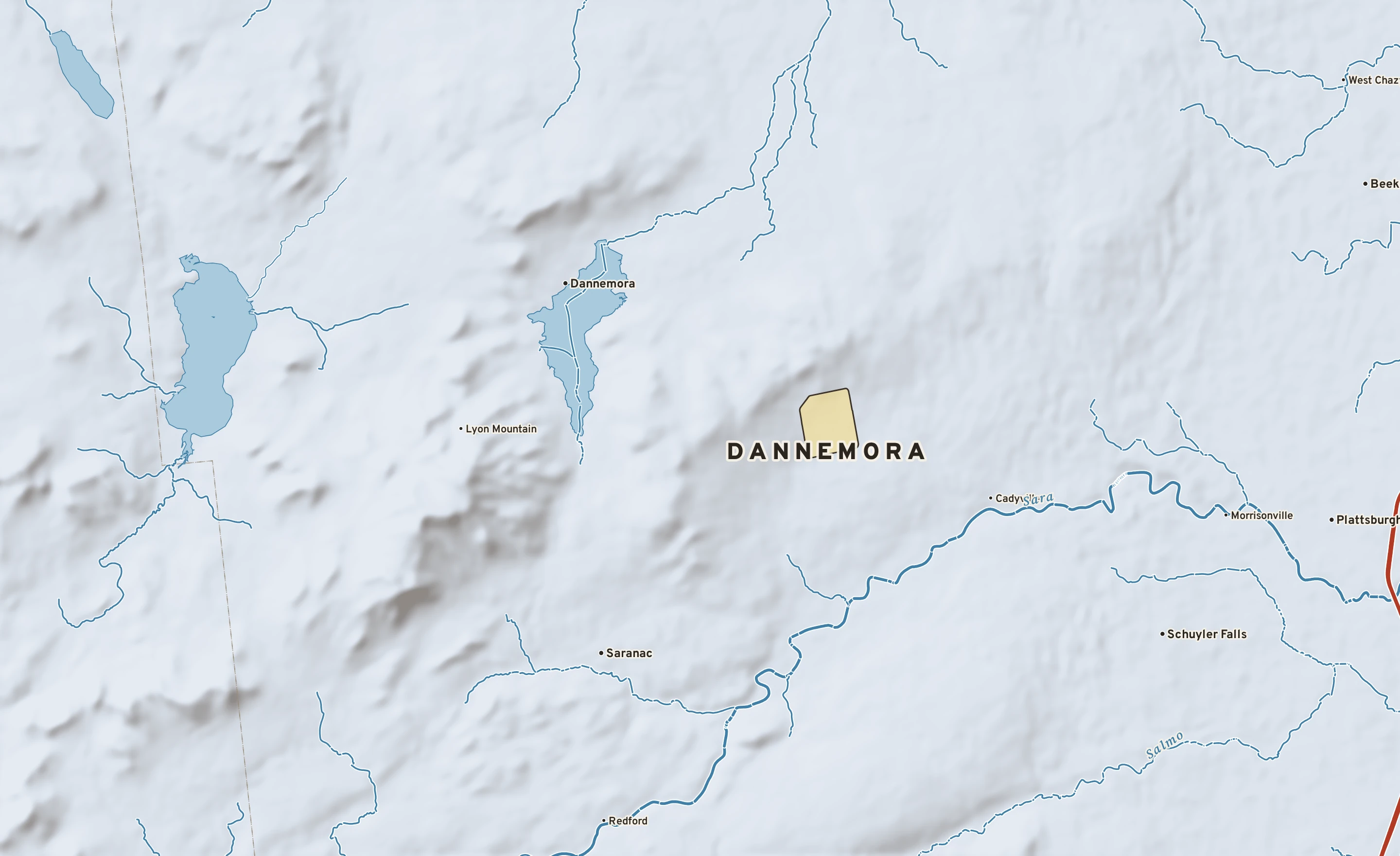 Shaded-relief atlas plate of Dannemora, New York: rivers, roads, the city limits and where the water drains.