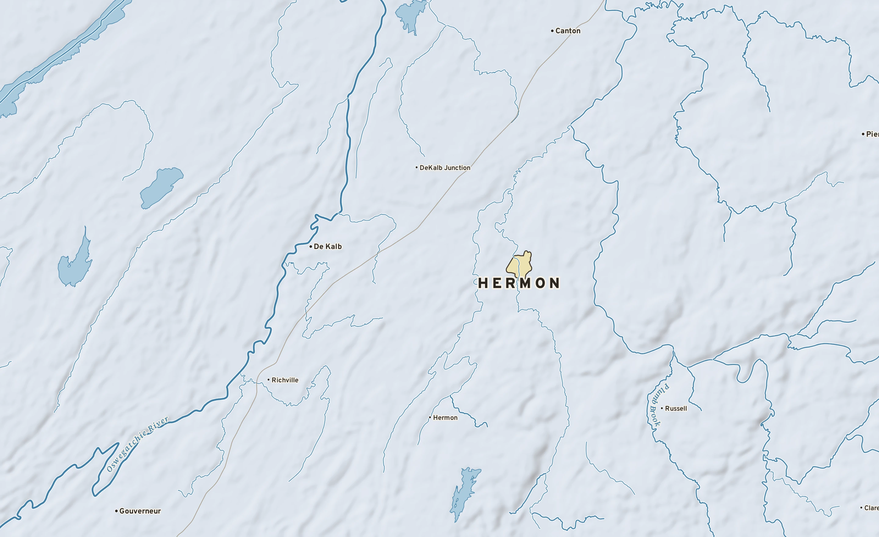 Shaded-relief atlas plate of Hermon, New York: rivers, roads, the city limits and where the water drains.