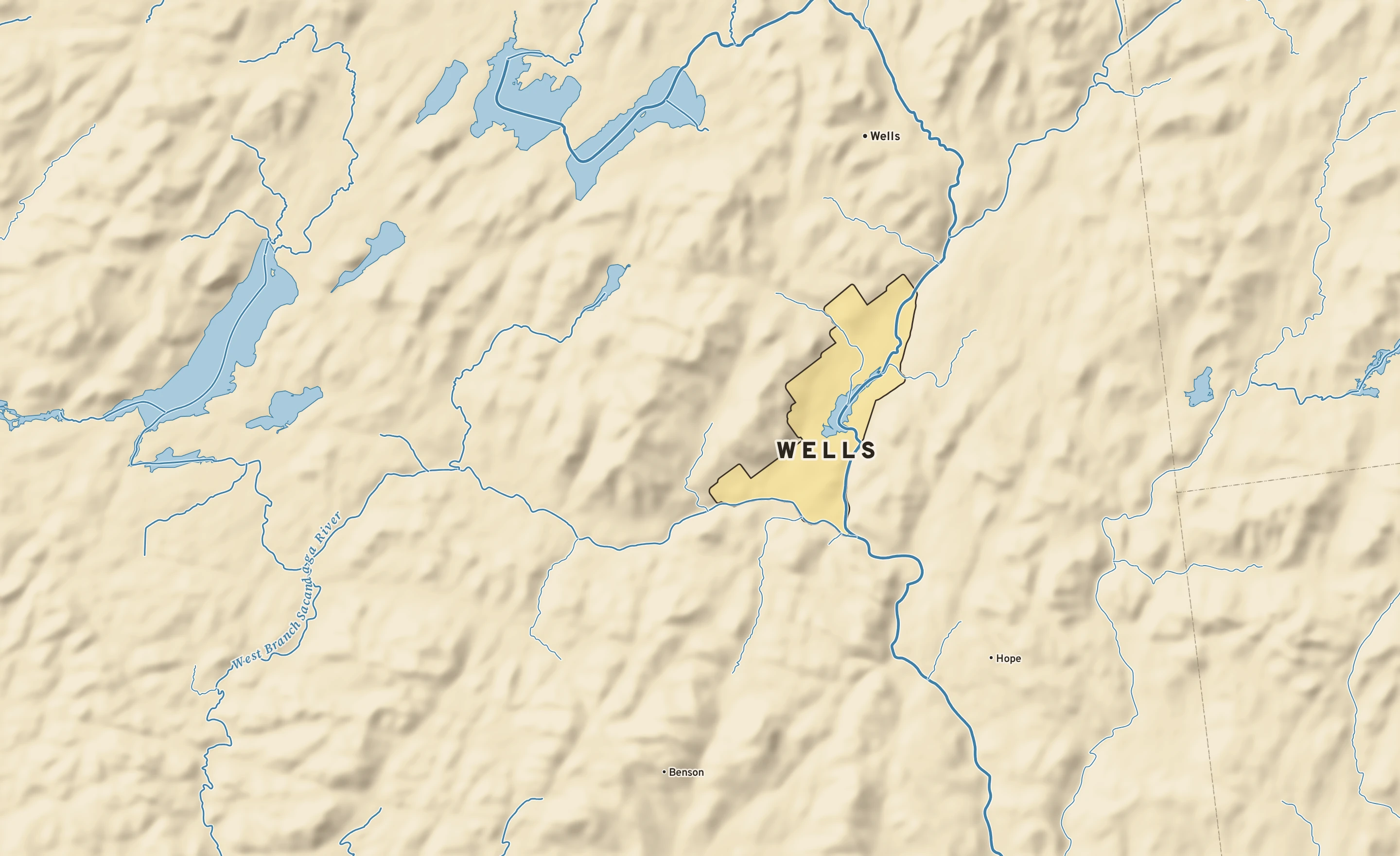 Shaded-relief atlas plate of Wells, New York: rivers, roads, the city limits and where the water drains.