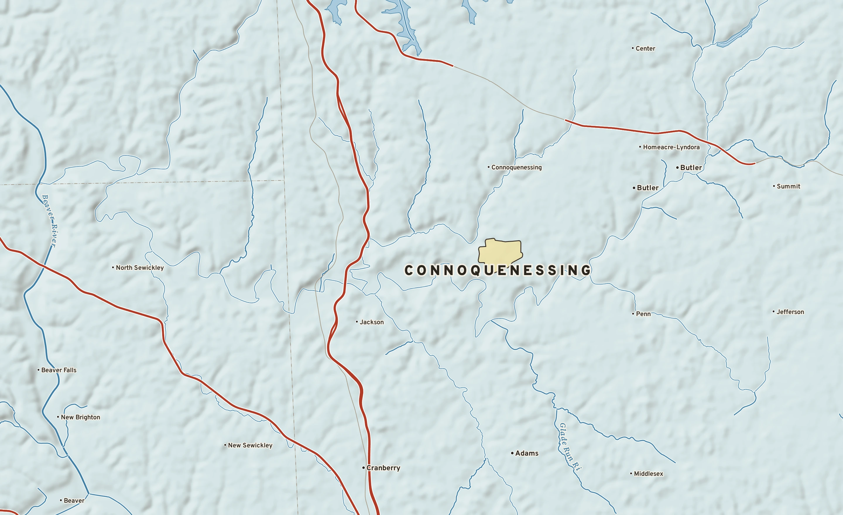 Shaded-relief atlas plate of Connoquenessing, Pennsylvania: rivers, roads, the city limits and where the water drains.