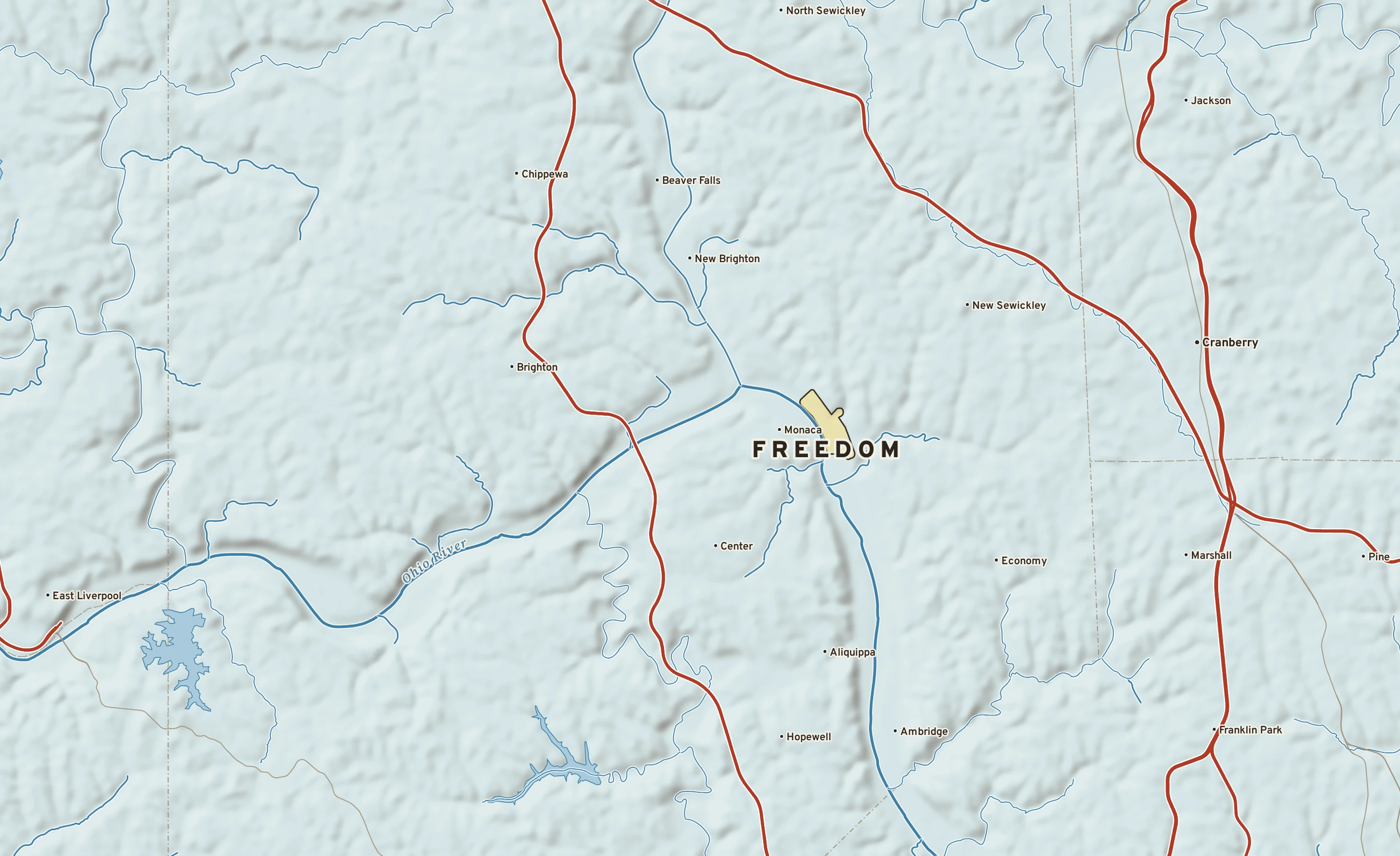 Shaded-relief atlas plate of Freedom, Pennsylvania: rivers, roads, the city limits and where the water drains.