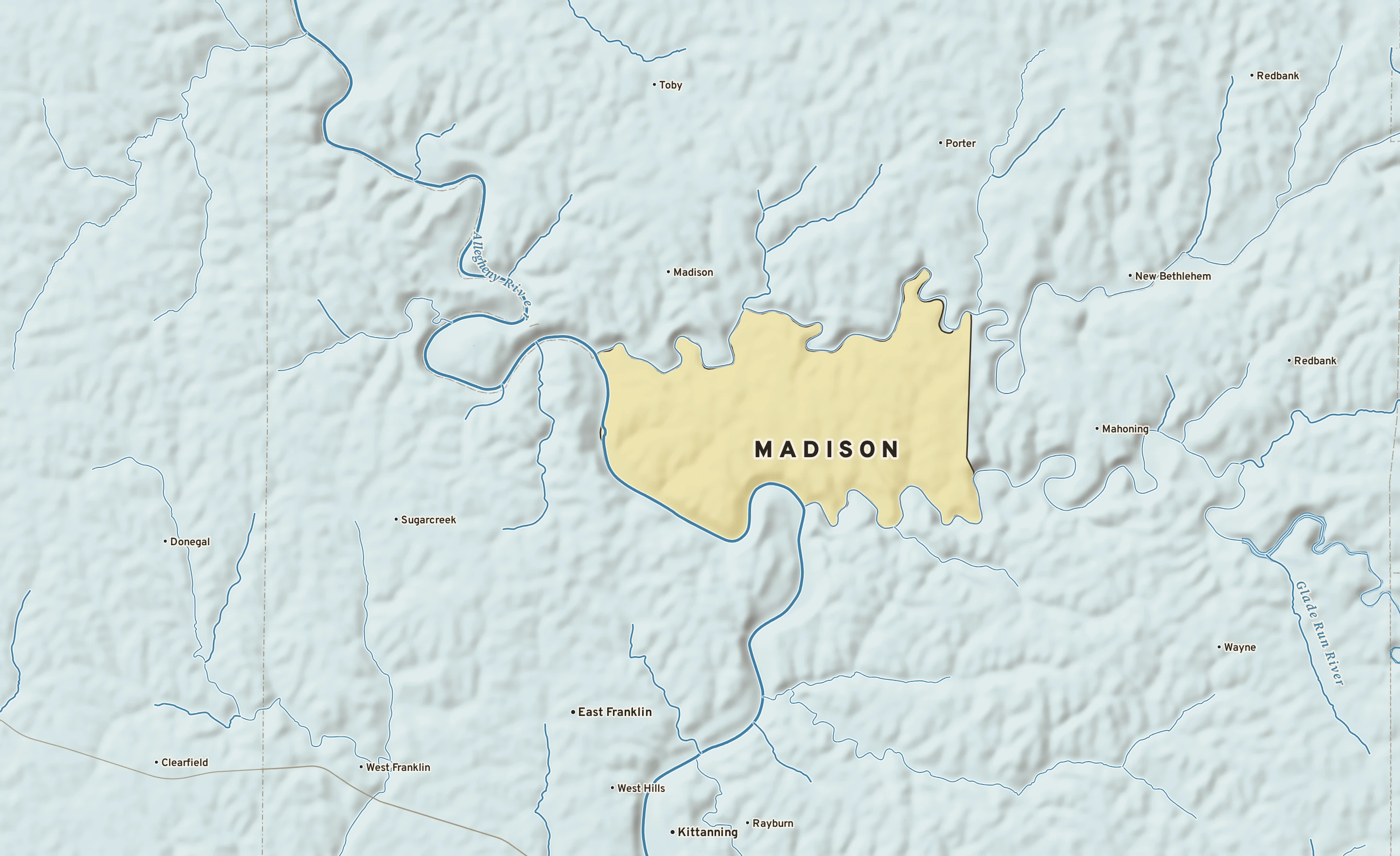 Shaded-relief atlas plate of Madison, Pennsylvania: rivers, roads, the city limits and where the water drains.