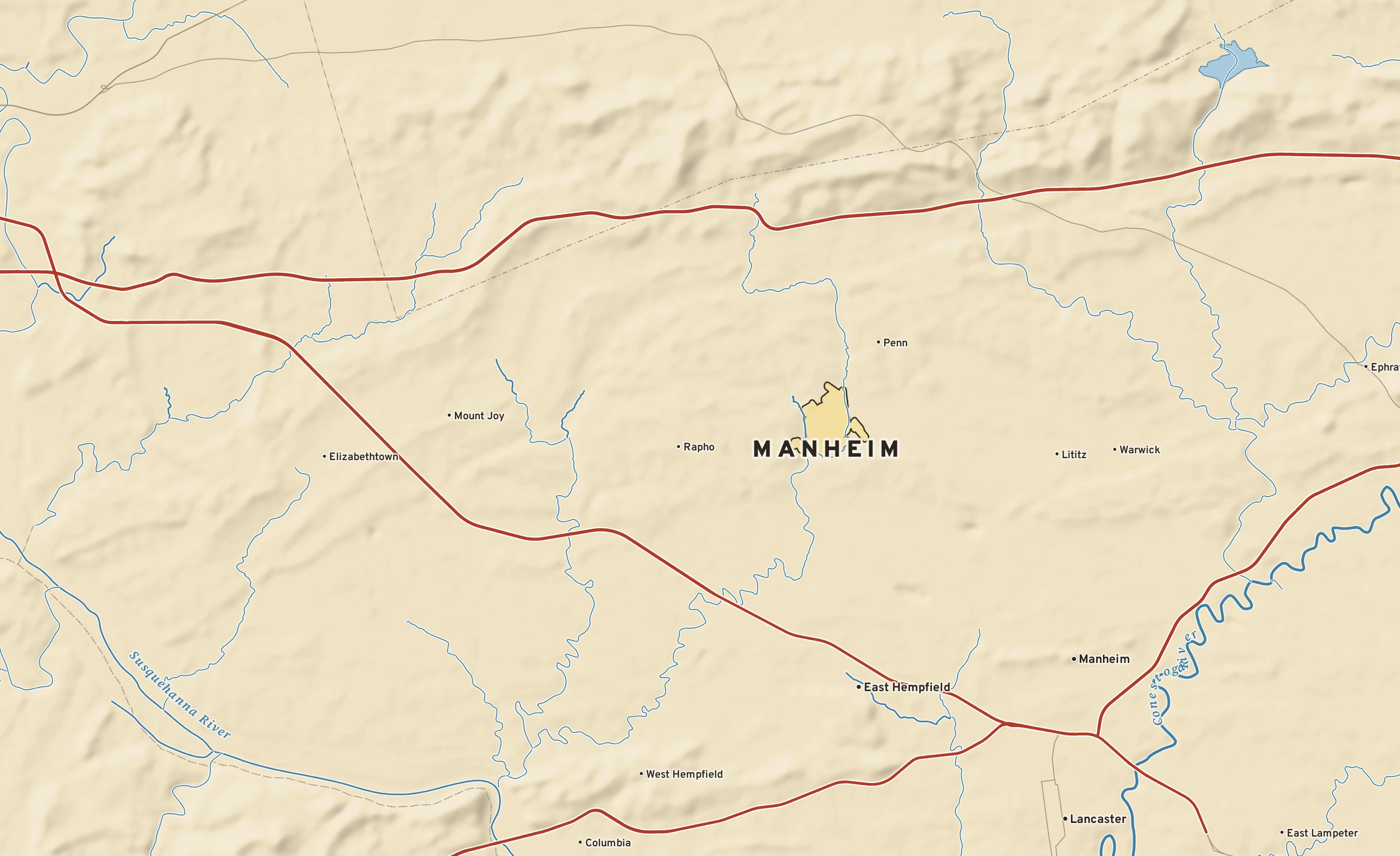 Shaded-relief atlas plate of Manheim, Pennsylvania: rivers, roads, the city limits and where the water drains.