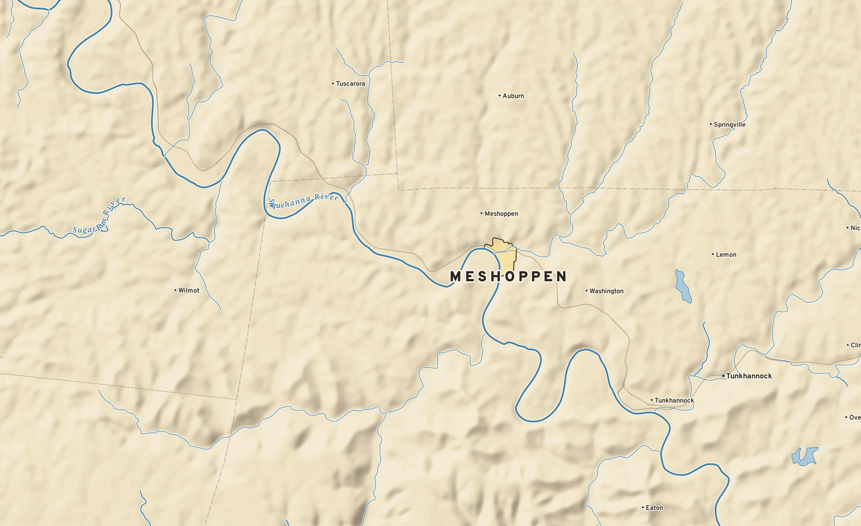 Shaded-relief atlas plate of Meshoppen, Pennsylvania: rivers, roads, the city limits and where the water drains.