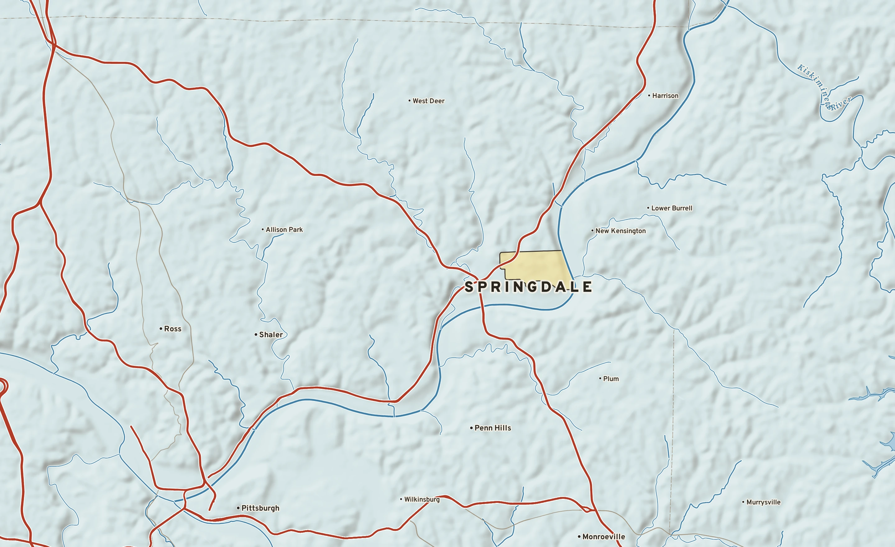 Shaded-relief atlas plate of Springdale, Pennsylvania: rivers, roads, the city limits and where the water drains.