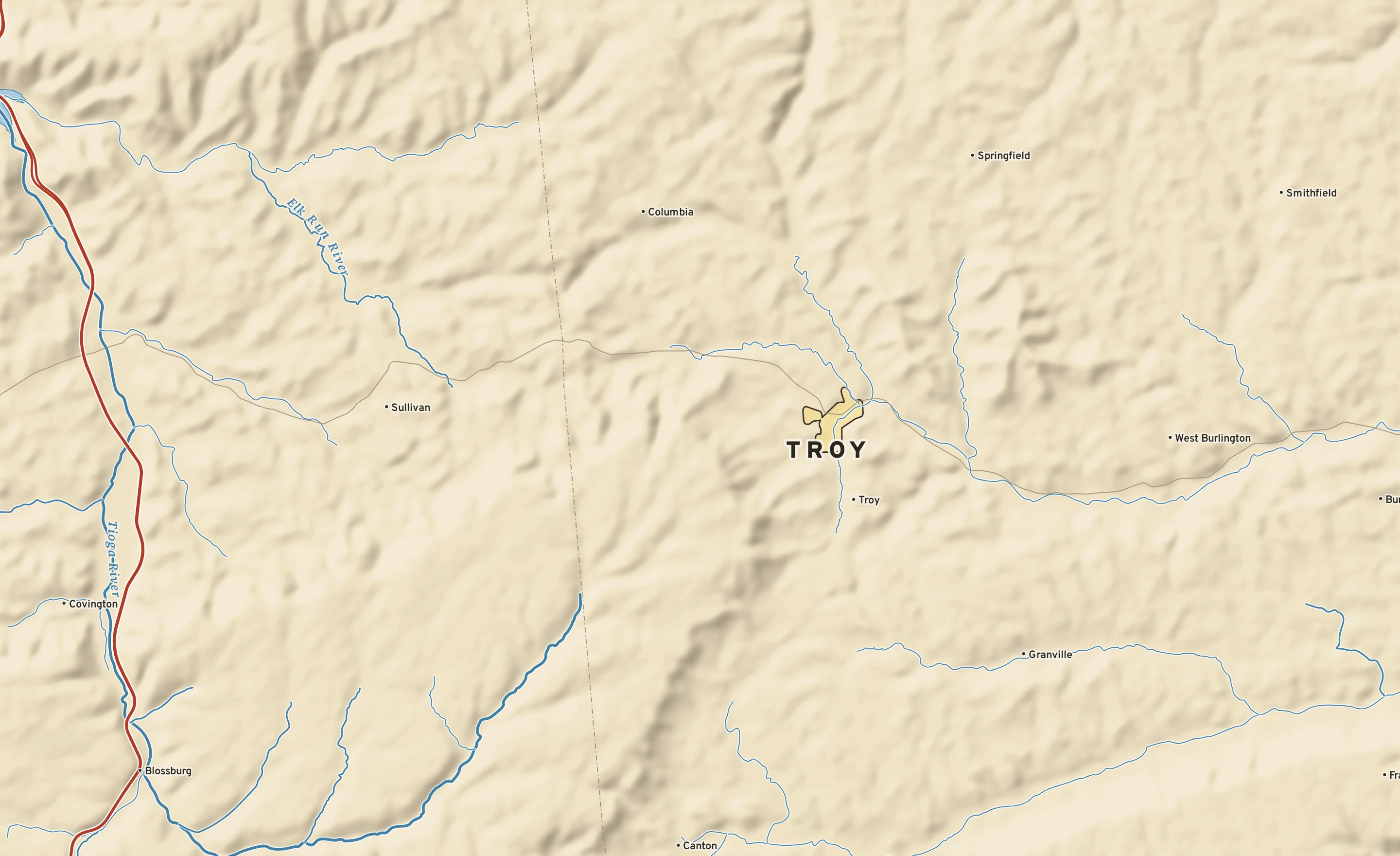 Shaded-relief atlas plate of Troy, Pennsylvania: rivers, roads, the city limits and where the water drains.