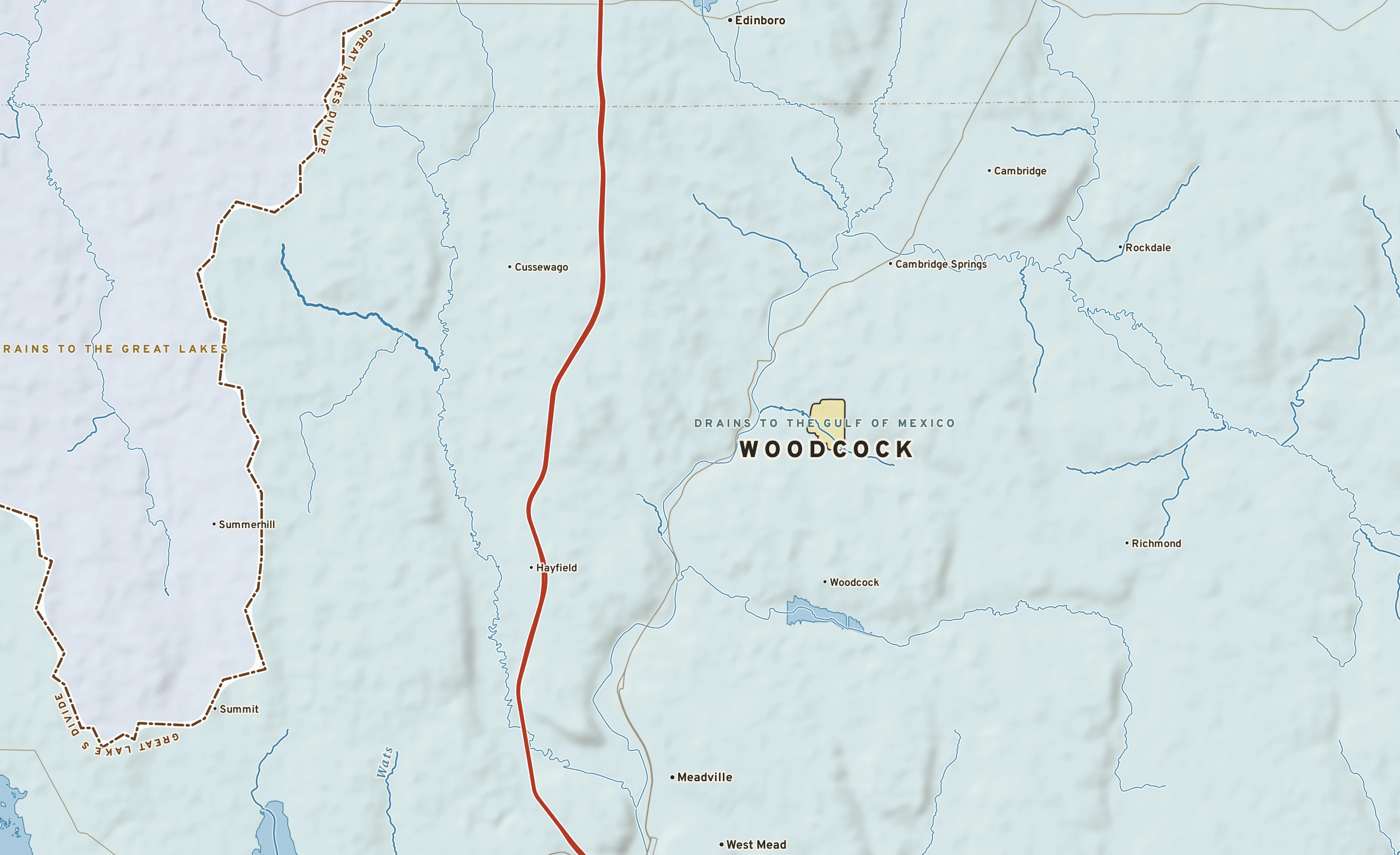 Shaded-relief atlas plate of Woodcock, Pennsylvania: rivers, roads, the city limits and where the water drains.