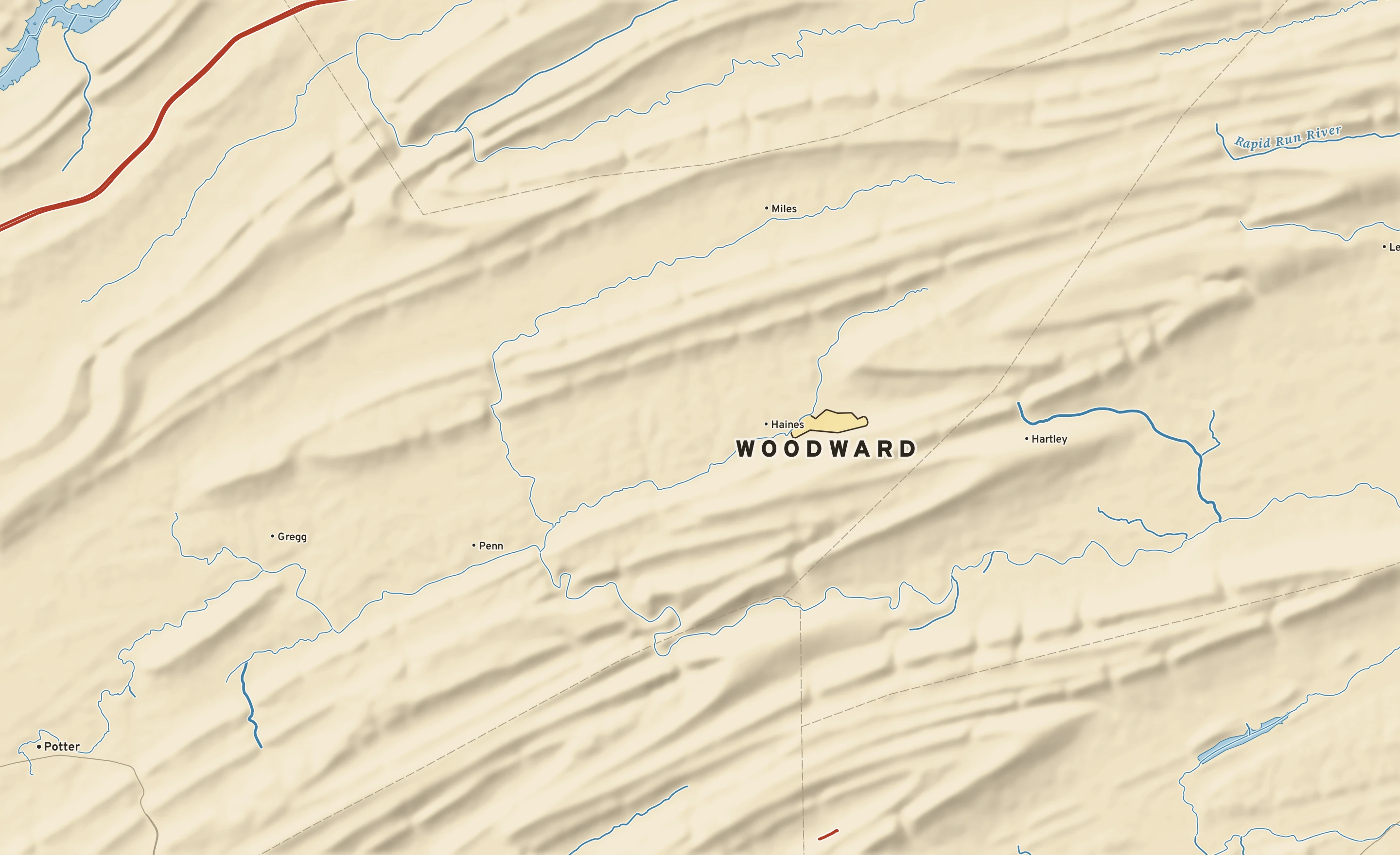 Shaded-relief atlas plate of Woodward, Pennsylvania: rivers, roads, the city limits and where the water drains.
