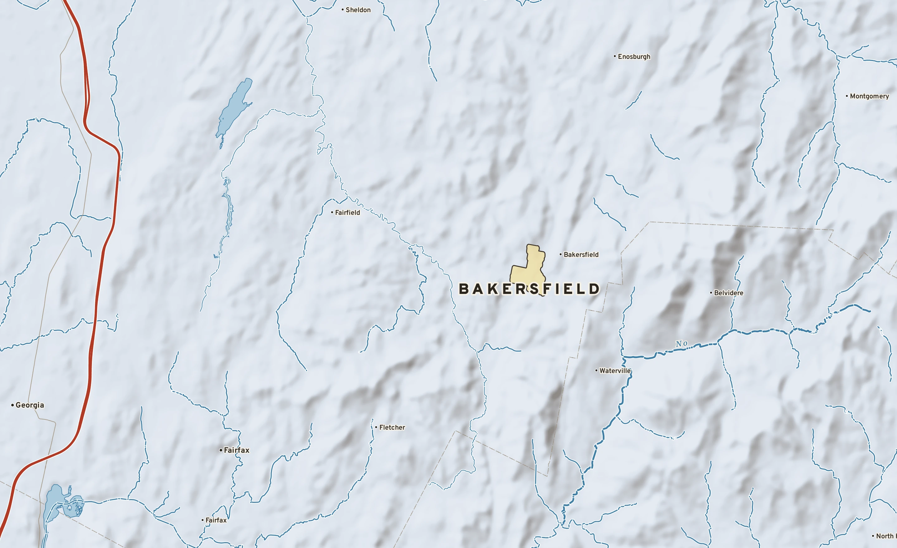 Shaded-relief atlas plate of Bakersfield, Vermont: rivers, roads, the city limits and where the water drains.