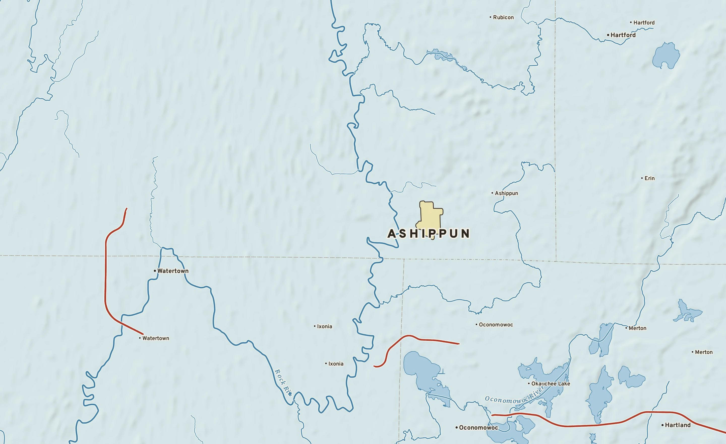 Shaded-relief atlas plate of Ashippun, Wisconsin: rivers, roads, the city limits and where the water drains.