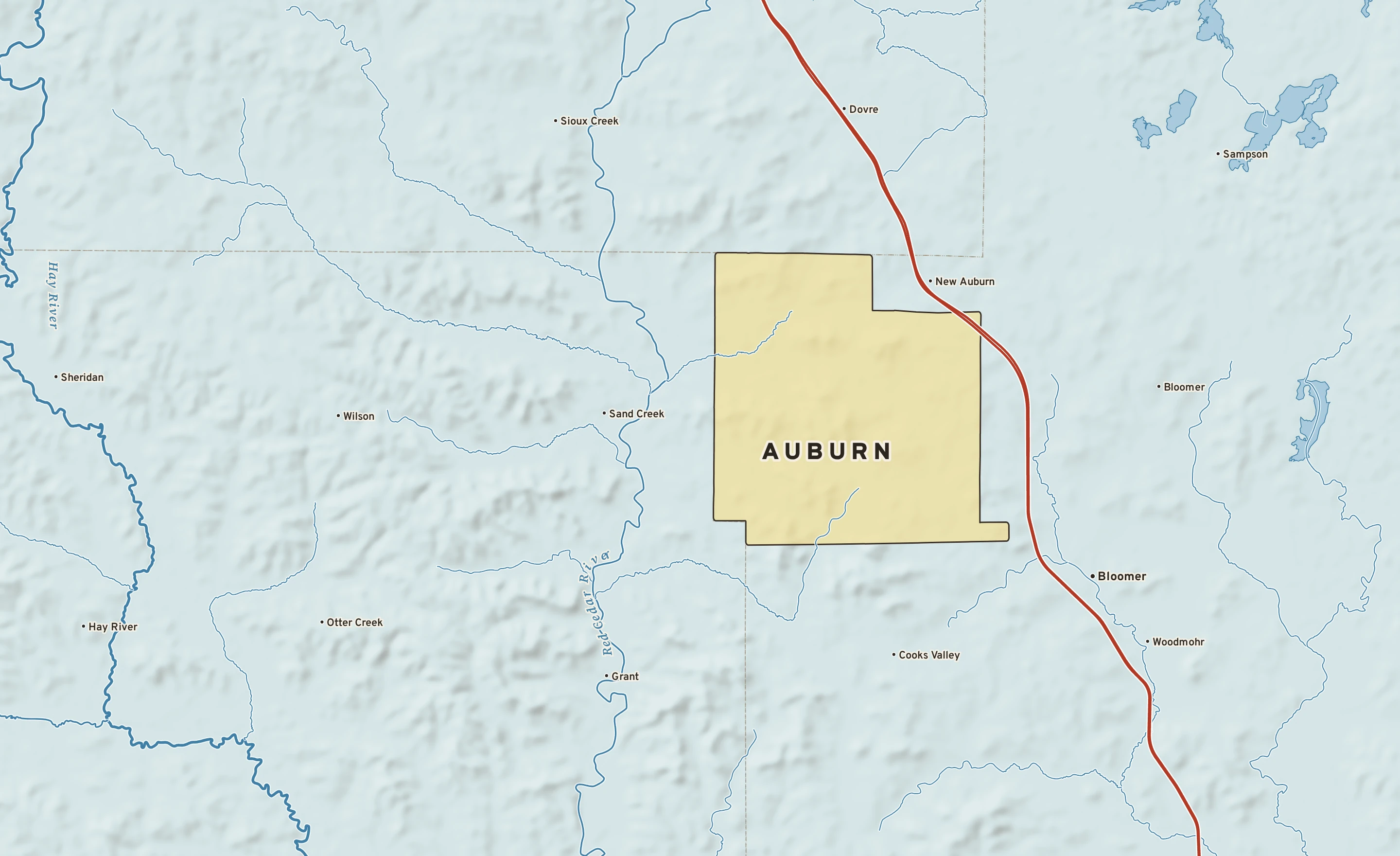 Shaded-relief atlas plate of Auburn, Wisconsin: rivers, roads, the city limits and where the water drains.
