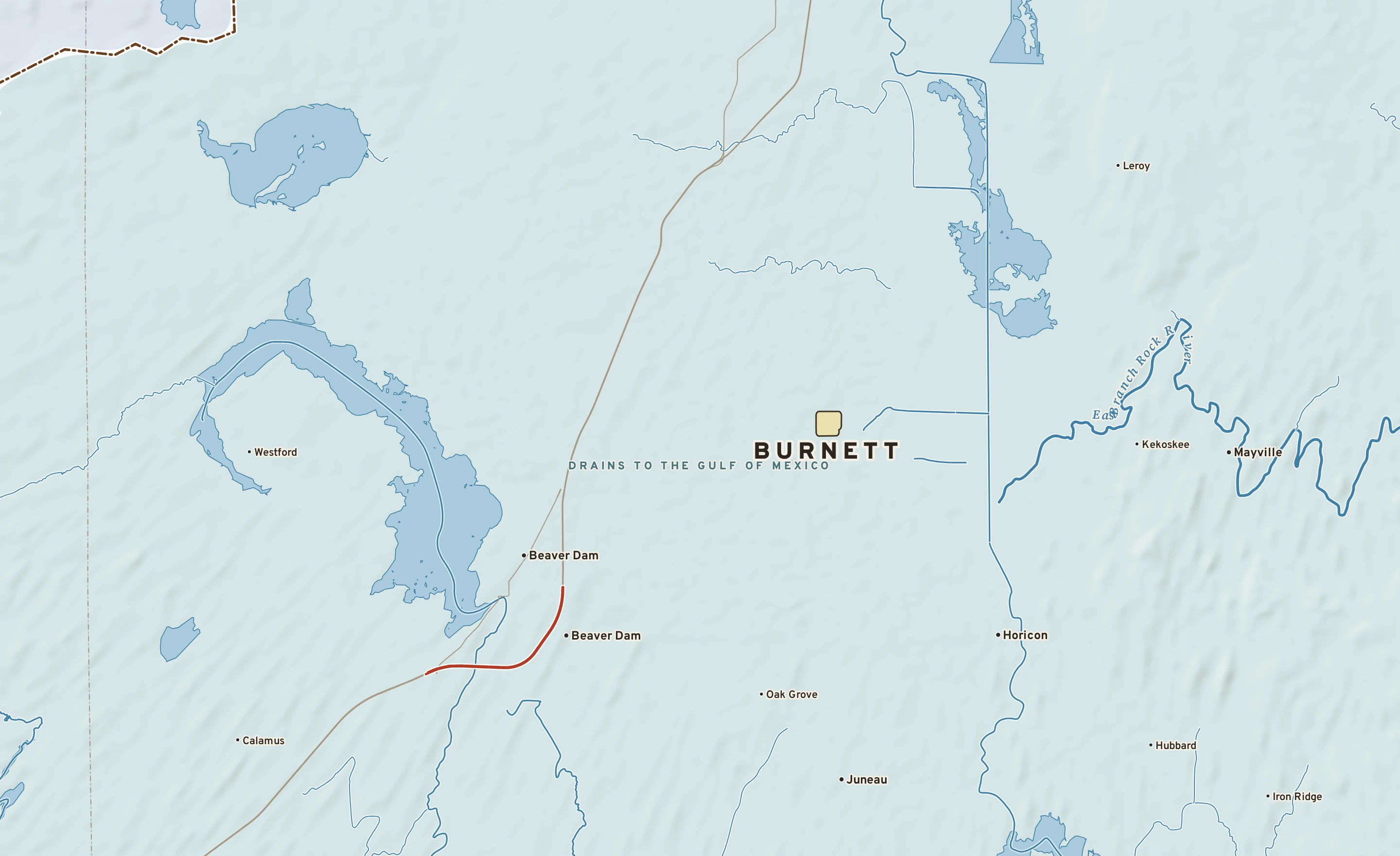 Shaded-relief atlas plate of Burnett, Wisconsin: rivers, roads, the city limits and where the water drains.