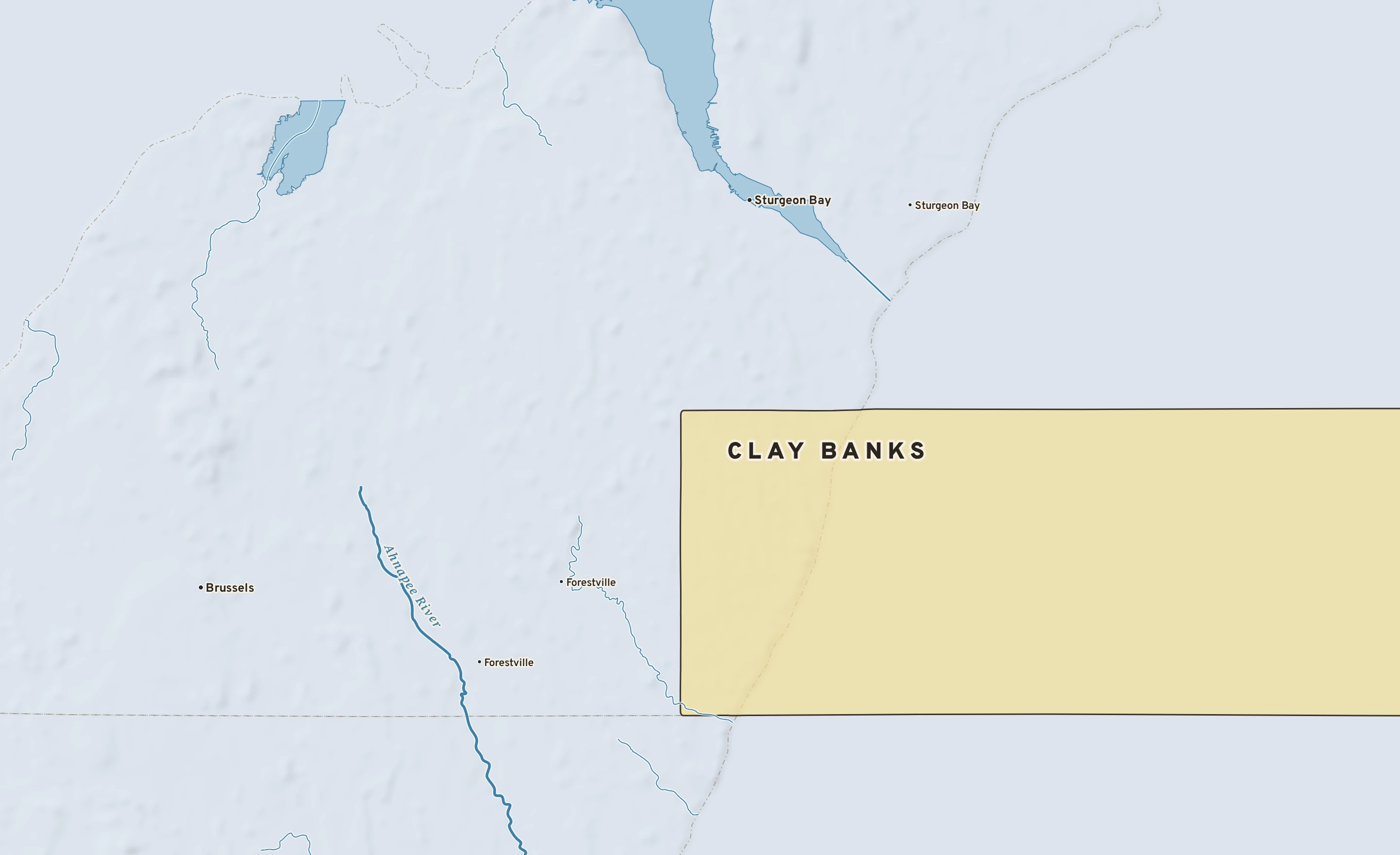 Shaded-relief atlas plate of Clay Banks, Wisconsin: rivers, roads, the city limits and where the water drains.