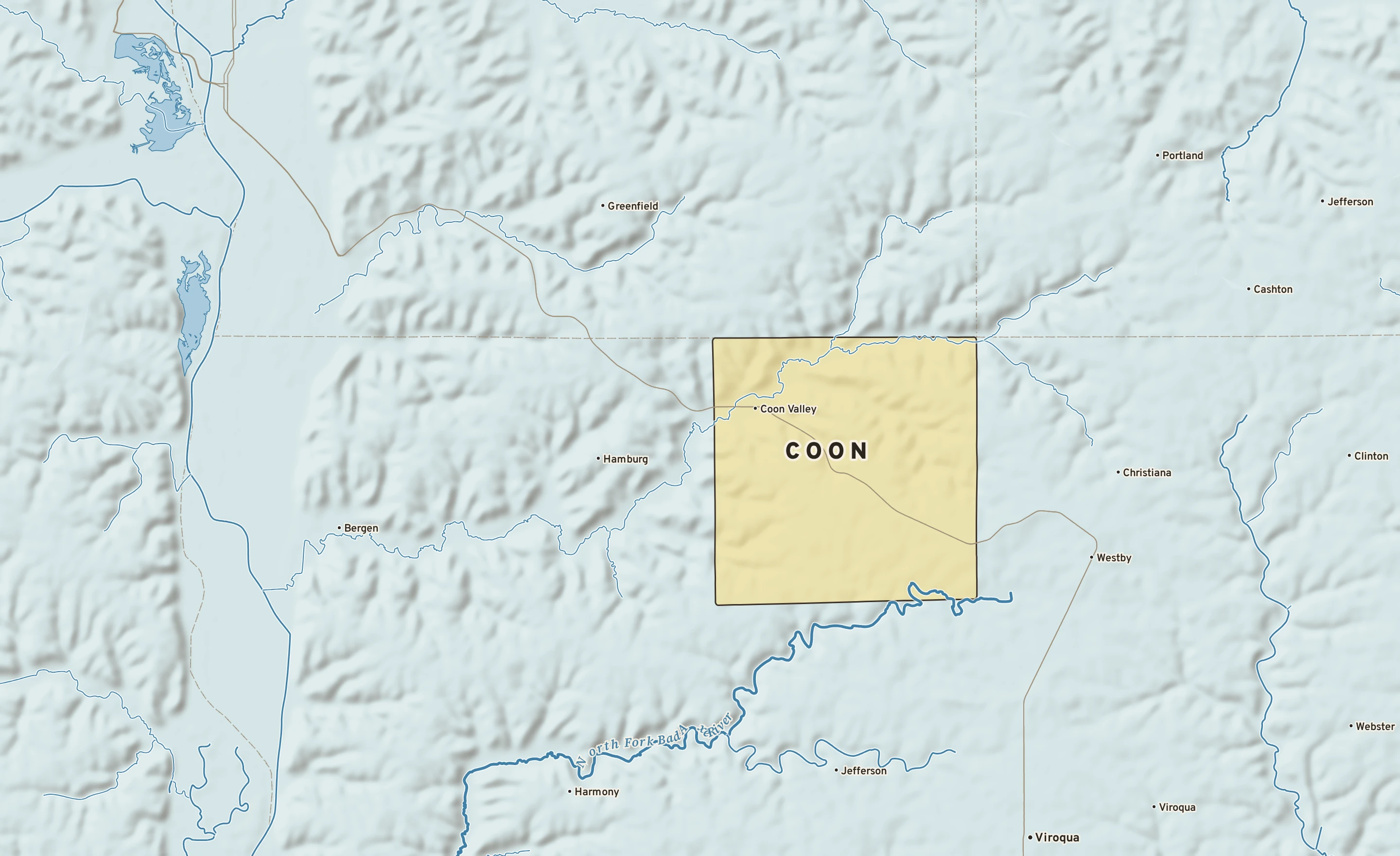 Shaded-relief atlas plate of Coon, Wisconsin: rivers, roads, the city limits and where the water drains.