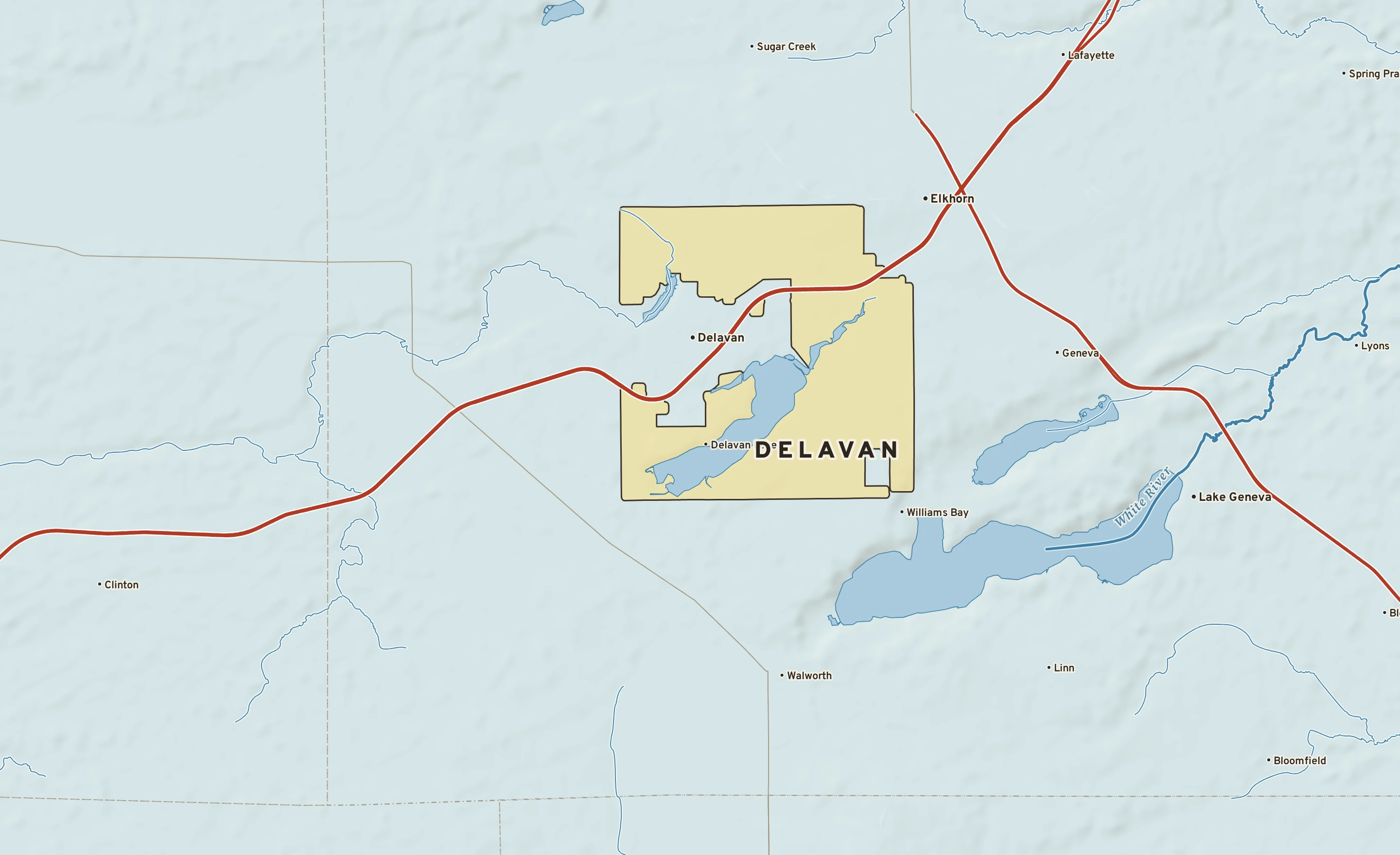 Shaded-relief atlas plate of Delavan, Wisconsin: rivers, roads, the city limits and where the water drains.