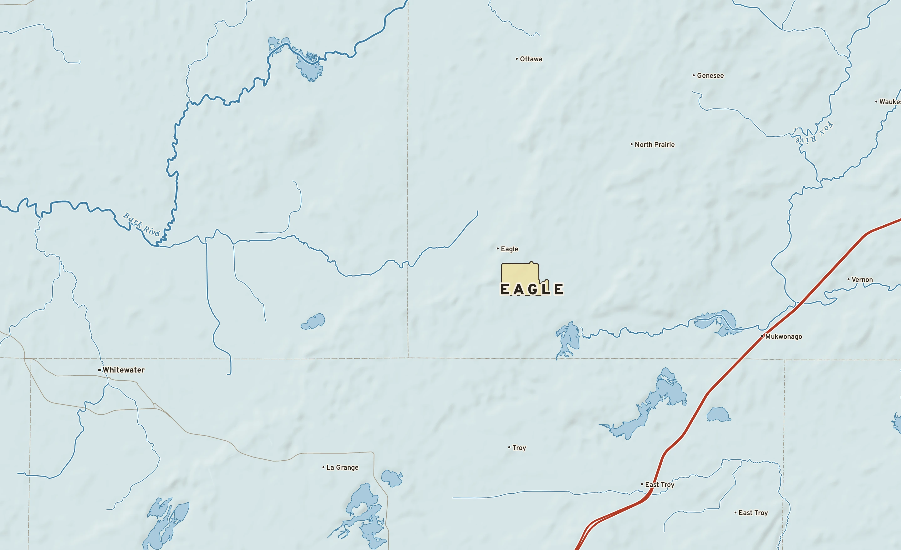 Shaded-relief atlas plate of Eagle, Wisconsin: rivers, roads, the city limits and where the water drains.