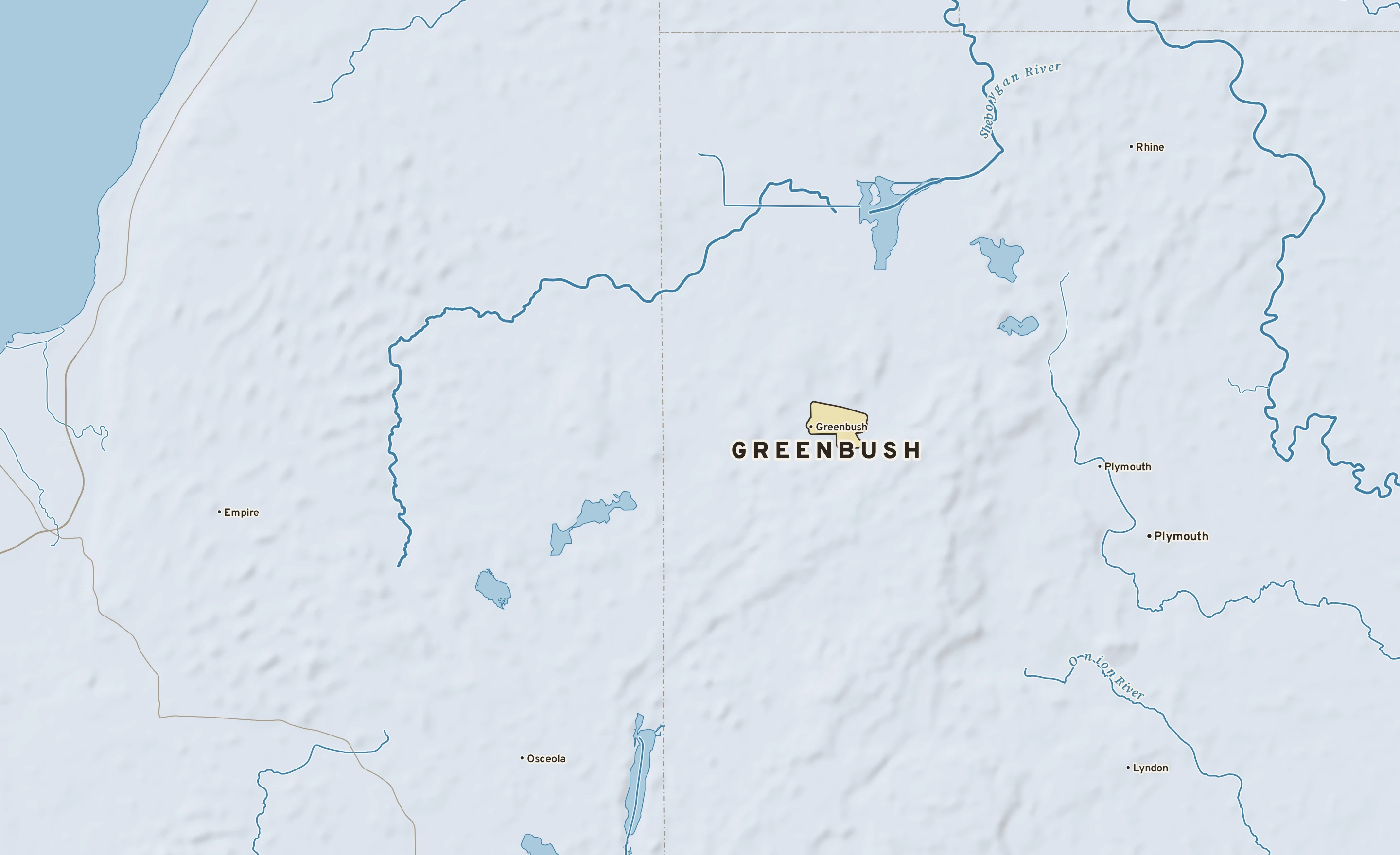 Shaded-relief atlas plate of Greenbush, Wisconsin: rivers, roads, the city limits and where the water drains.