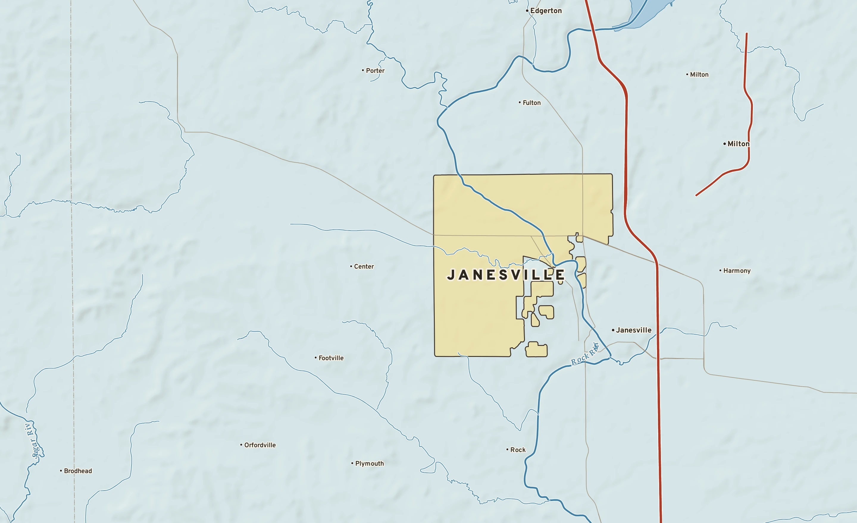 Shaded-relief atlas plate of Janesville, Wisconsin: rivers, roads, the city limits and where the water drains.